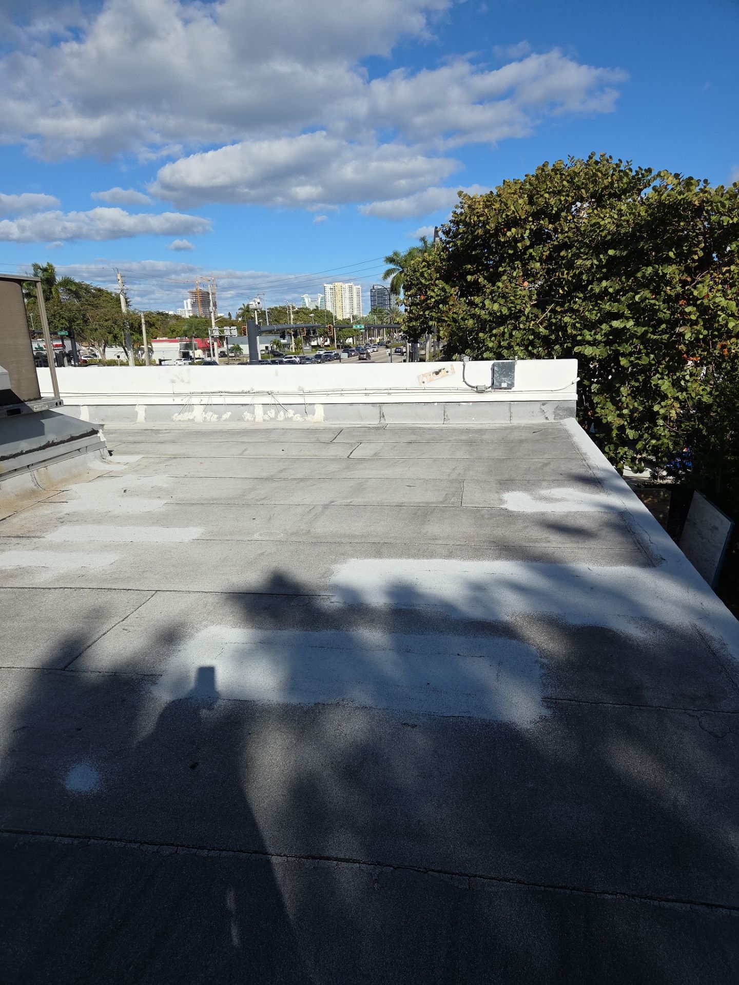 Commercial Flat Roof Restoration Using Silicone Coating in Hallandale Beach by Aastro Roofing
