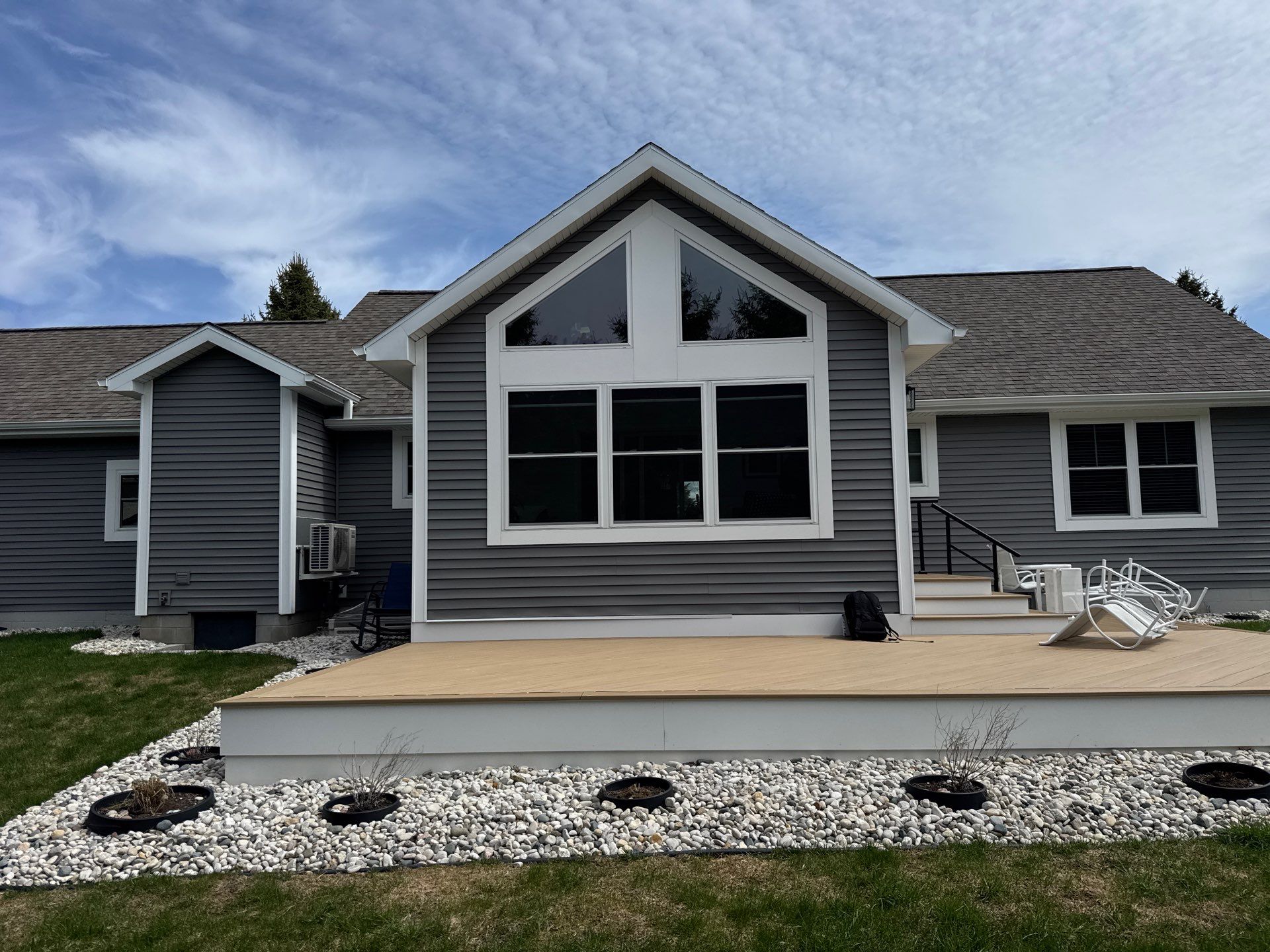 Sunesta Retractable Awning and Composite Deck Installation in Petoskey by Rainbow Seamless Systems