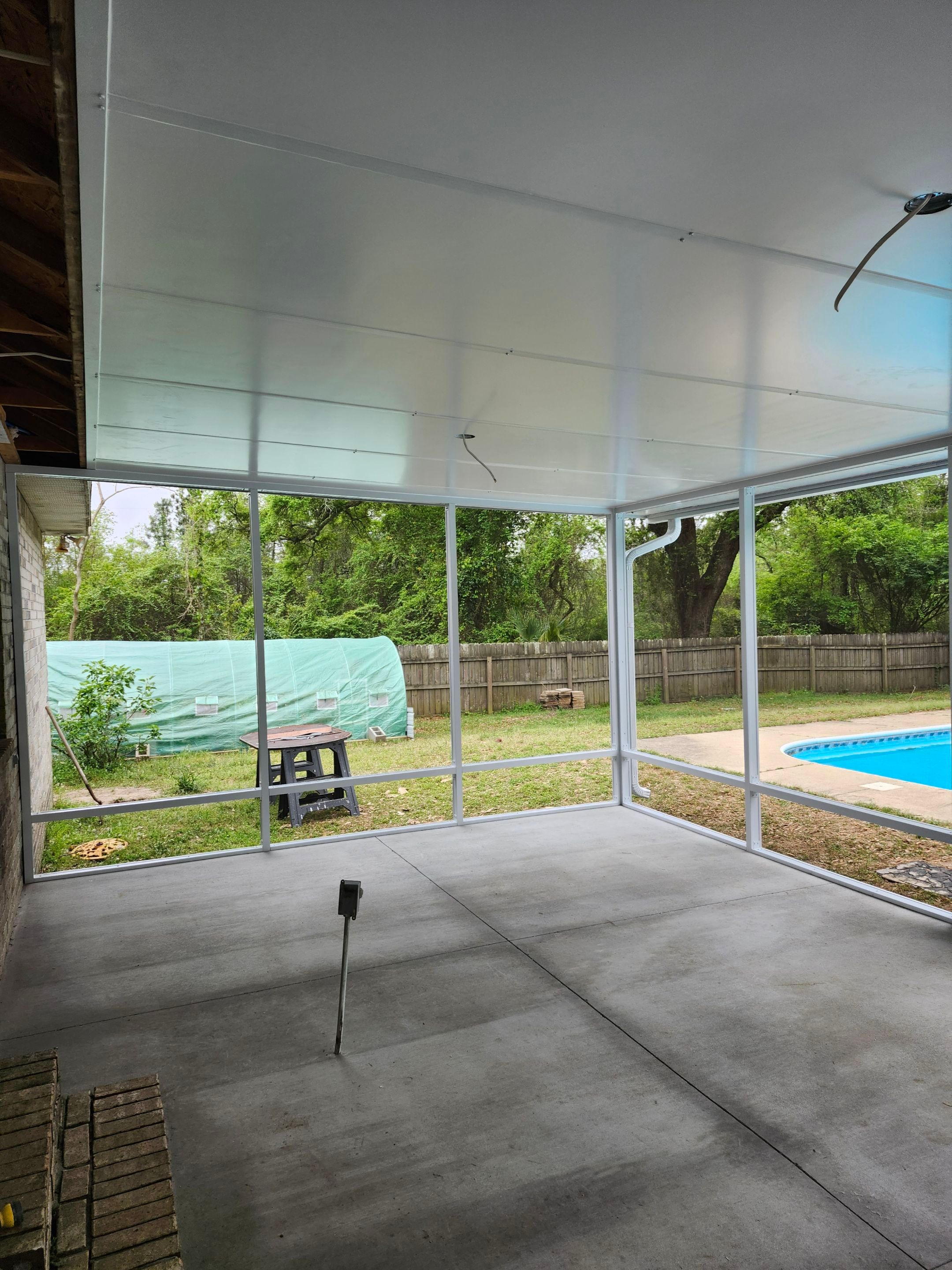 Poolside Screen Room in Pace by Titan Sunrooms