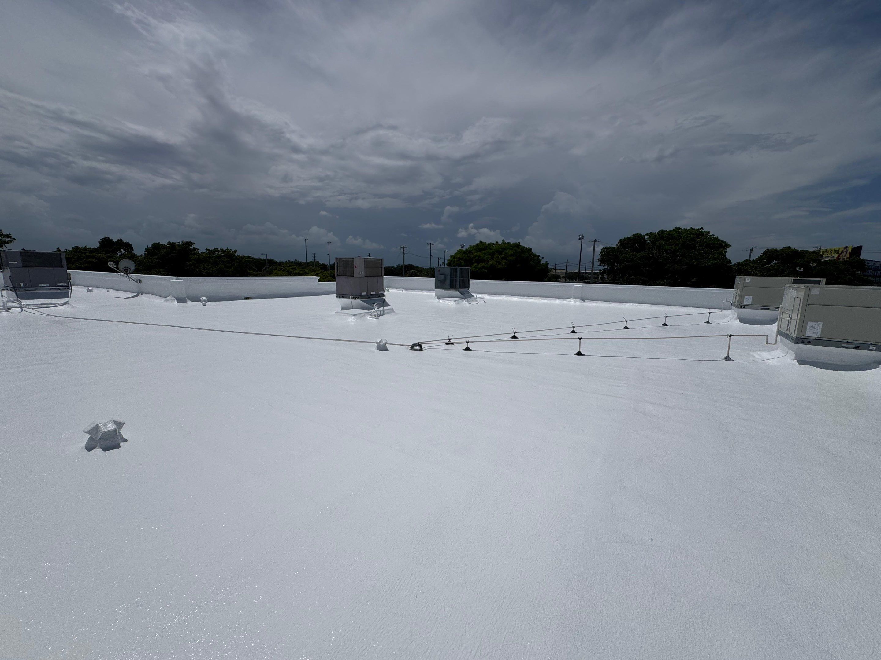 Commercial Flat Roof Restoration and Elastomeric Waterproofing in Delray Beach by Roof King LLC