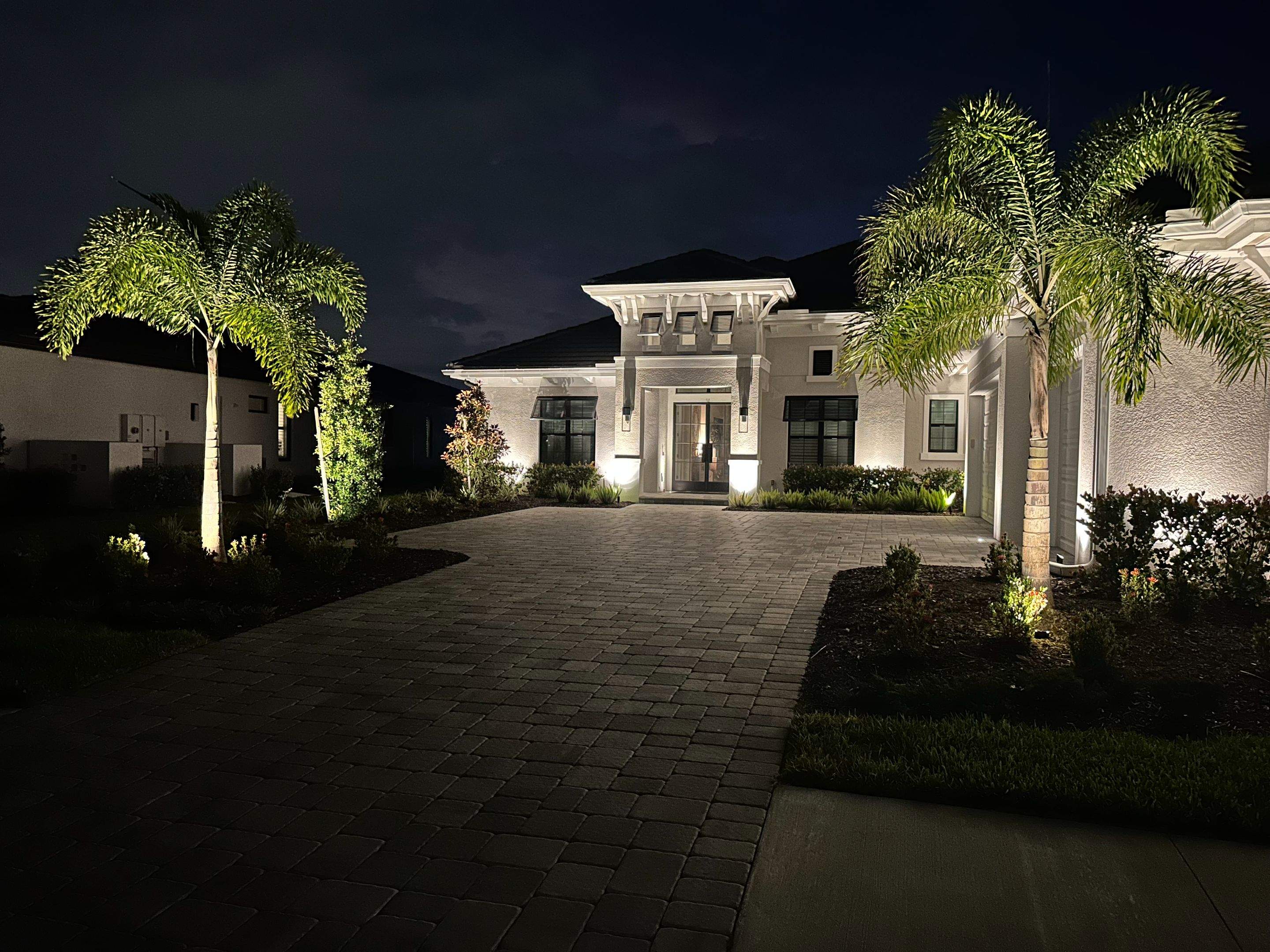 Architectural and Landscape Lighting Installation for Modern Sarasota Home by Illuminate Landscape Designs