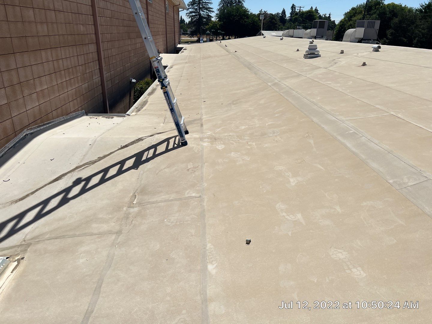 MR Roofing system using Benchmark/PUMA XL coatings over TPO single-ply roofing by Straight Edge Roofing Inc