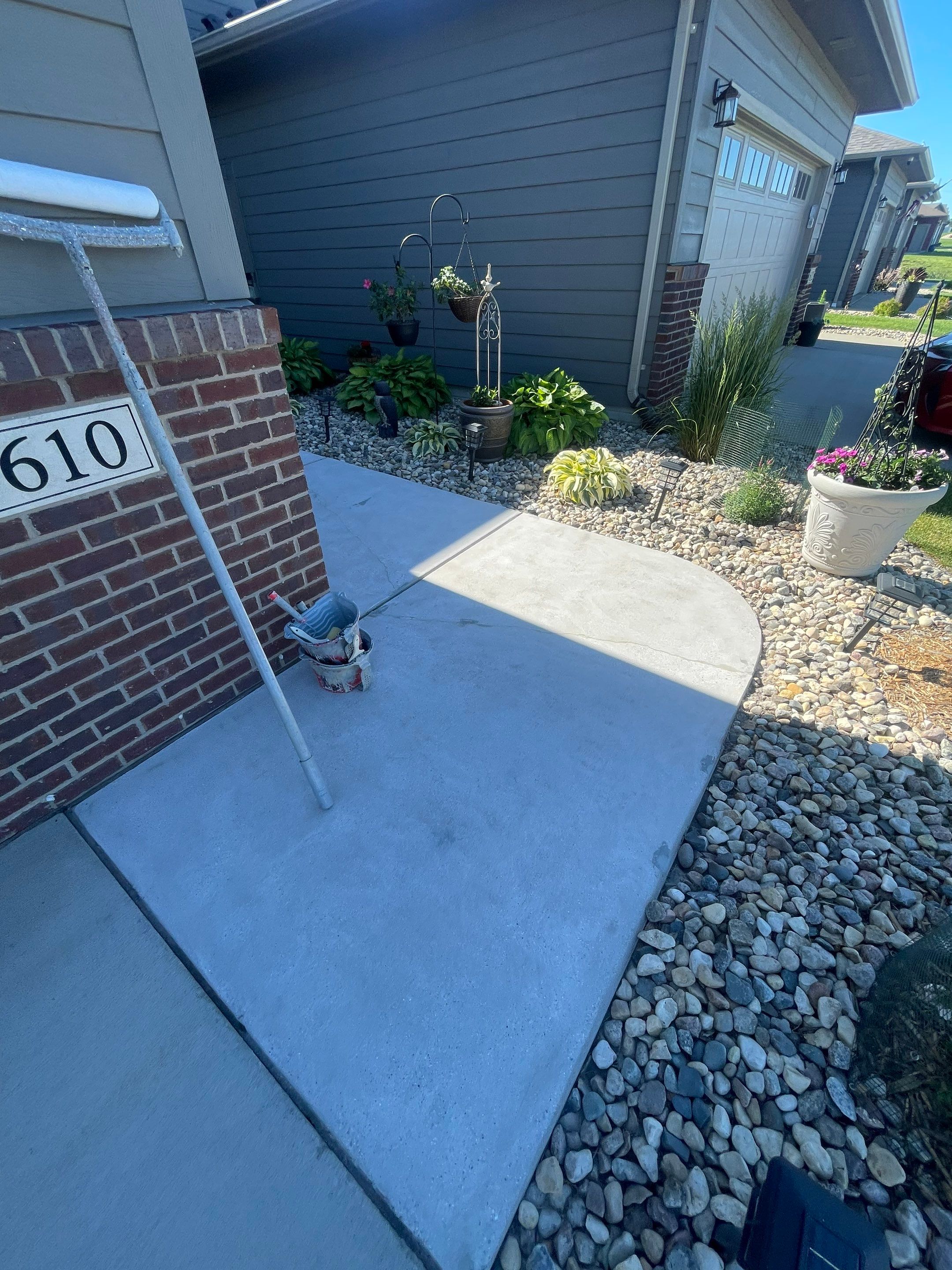 Custom Concrete Coating for Sioux Falls Patio and Front Walkway by Select Painting, Coatings & Garage Cabinets