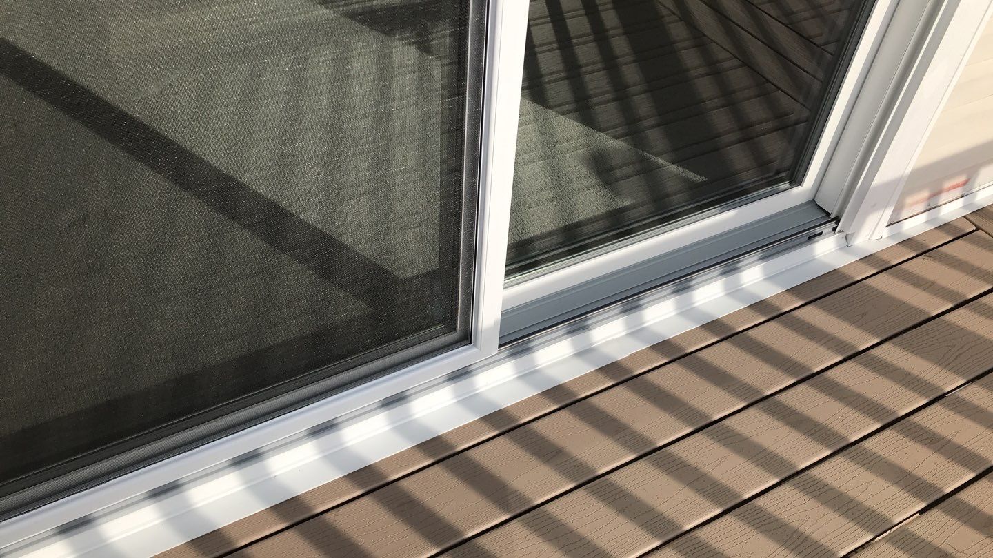Deck Refurbush and Door Replacement using Trex Decking and Railing. Polaris Patio Doors by Secure Construction Company Inc