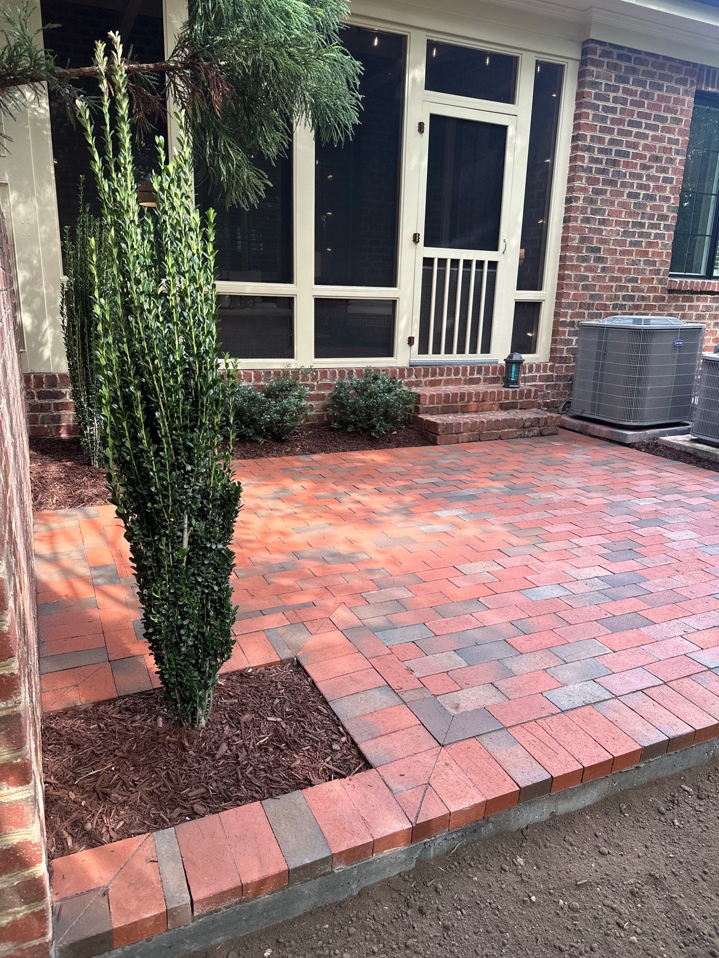 Brick patio in Durham by Martinez Brother’s Nc Landscaping Inc