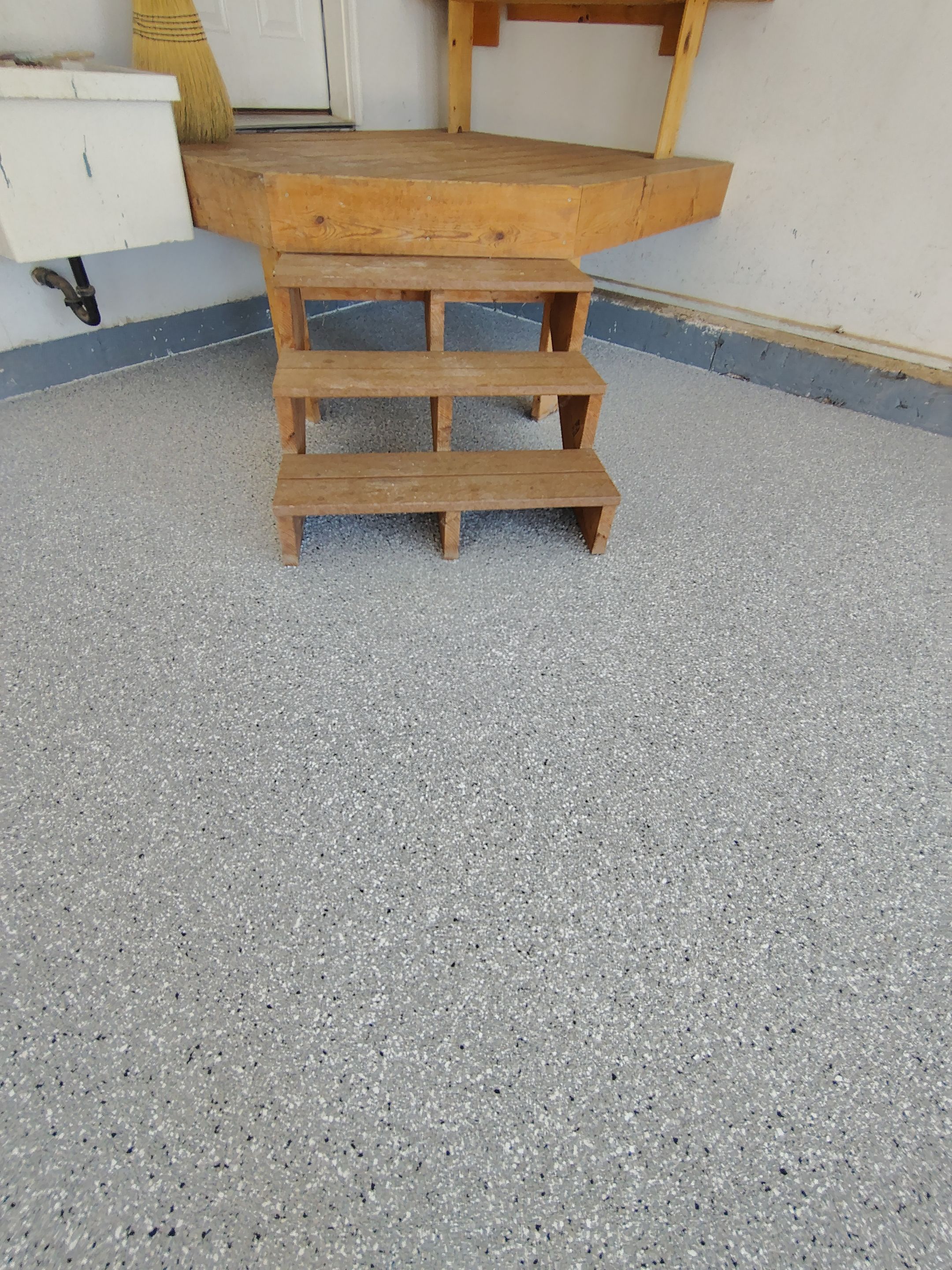 Feather Grey Garage Floor Coating Installation in Valley Springs by Select Painting, Coatings & Garage Cabinets