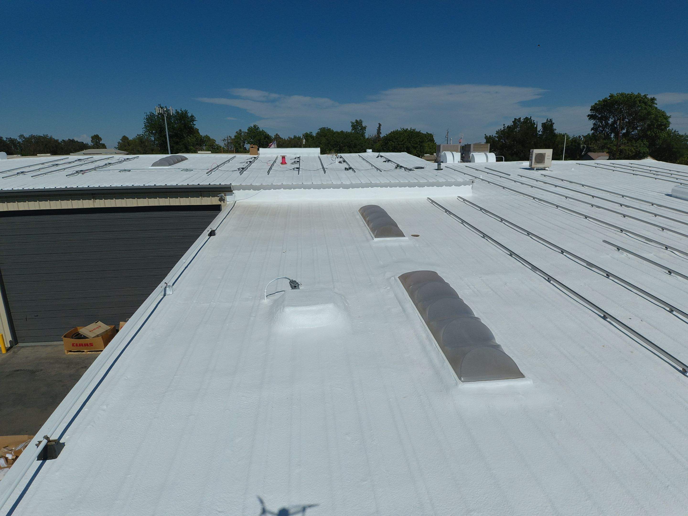 Spray foam and coatings using Conklin Benchmark/PUMA XL coatings and spray foam by Straight Edge Roofing Inc