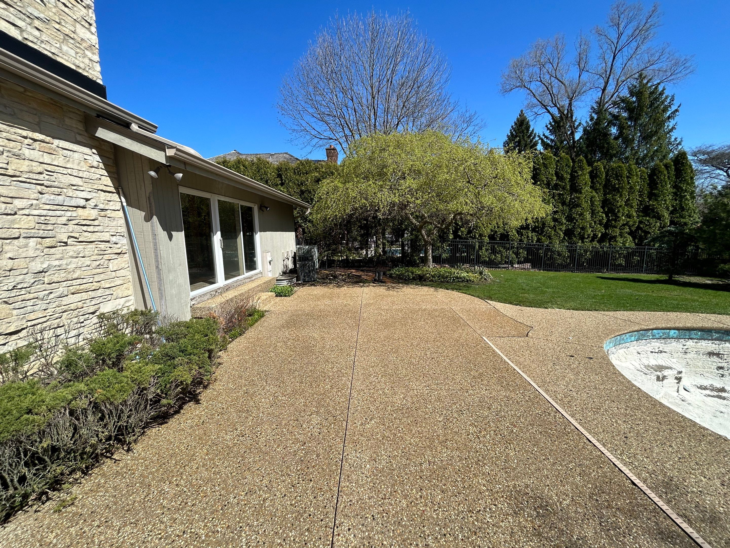 Aggregate Clean and seal using low gloss sealer by Northern Power Washing LLC.