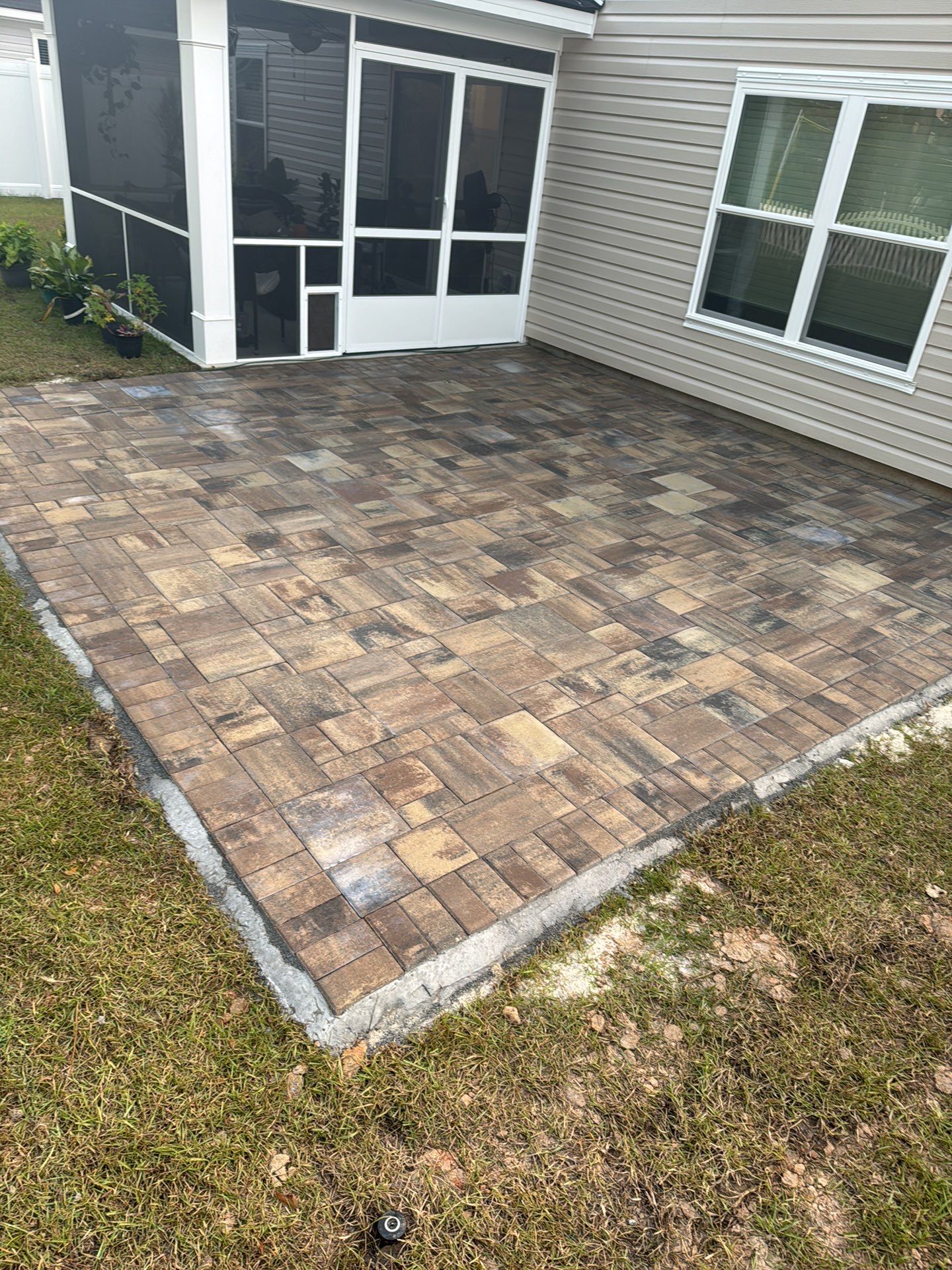 Custom Multi-Toned Paver Patio Installation in Bluffton by Lowcountry Scapes, LLC