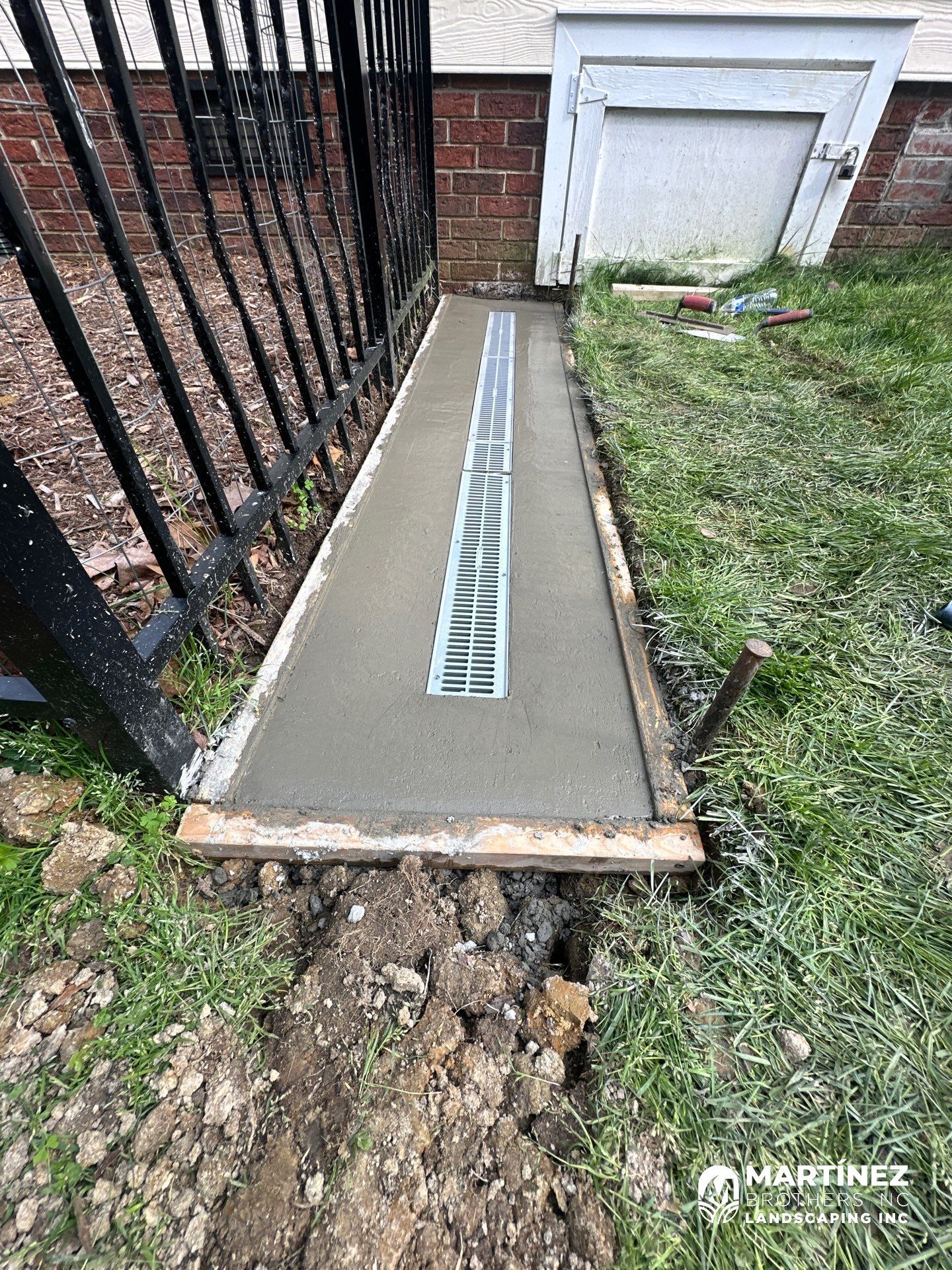 Channel drain installation Durham by Martinez Brother’s Nc Landscaping Inc