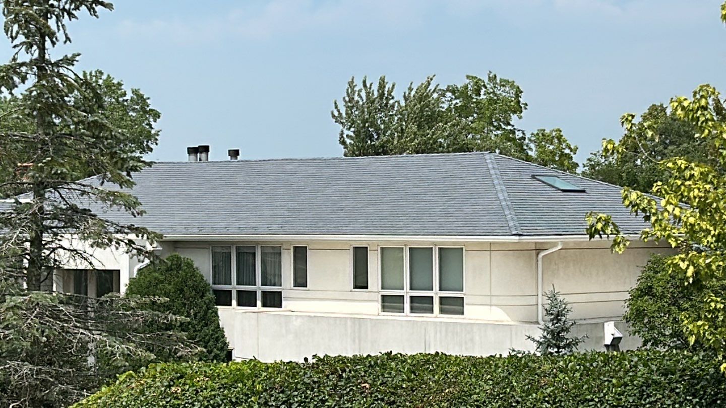DaVinci Slate Roof Installation and Aluminum Gutter by Custom Installations