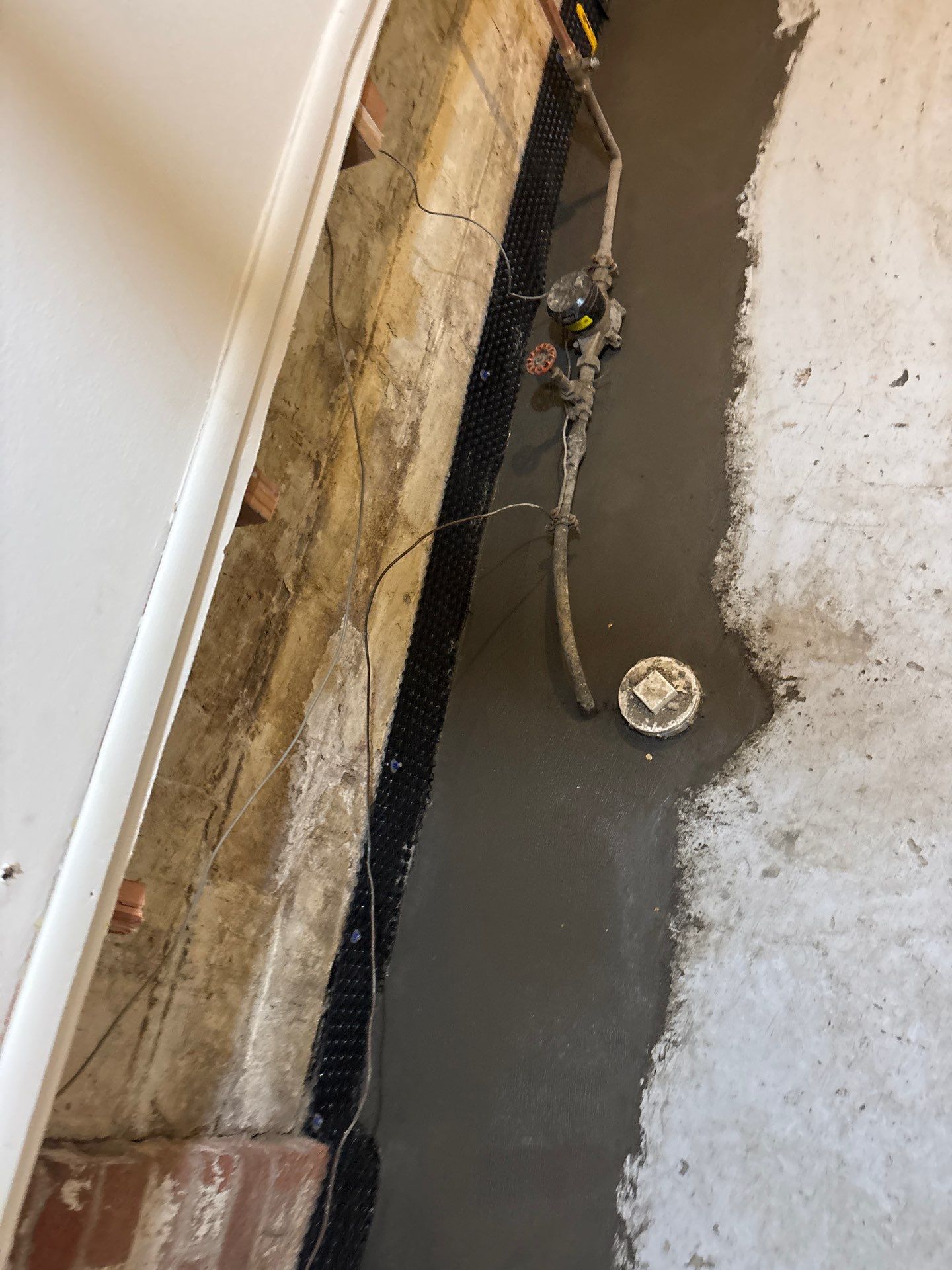 Interior Drain Tile & Sump Pump Installation in St. Paul, MN by Waterproofing Northeast