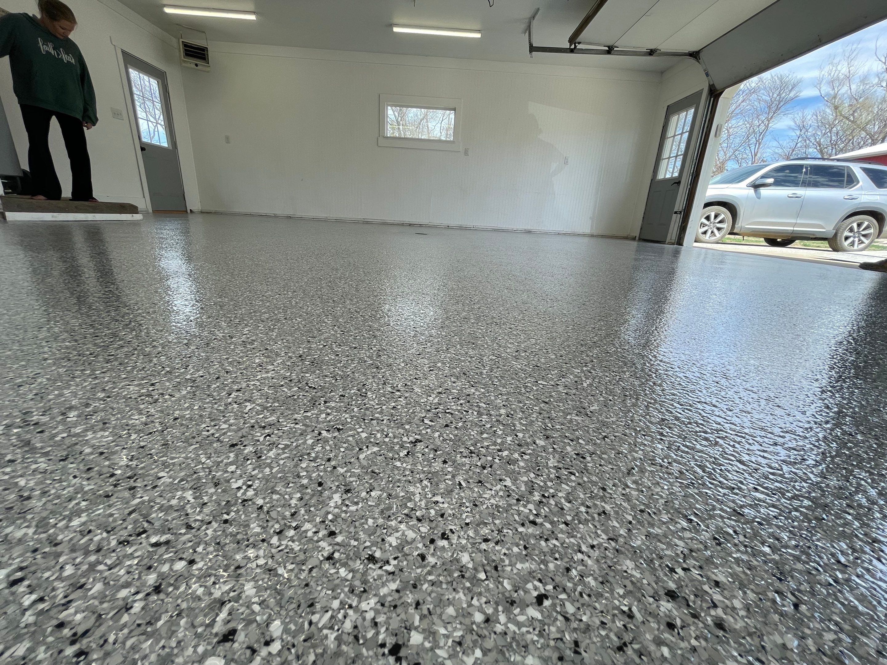 Feather Grey Garage Floor Coating and Crack Repair in Beresford by Select Painting, Coatings & Garage Cabinets