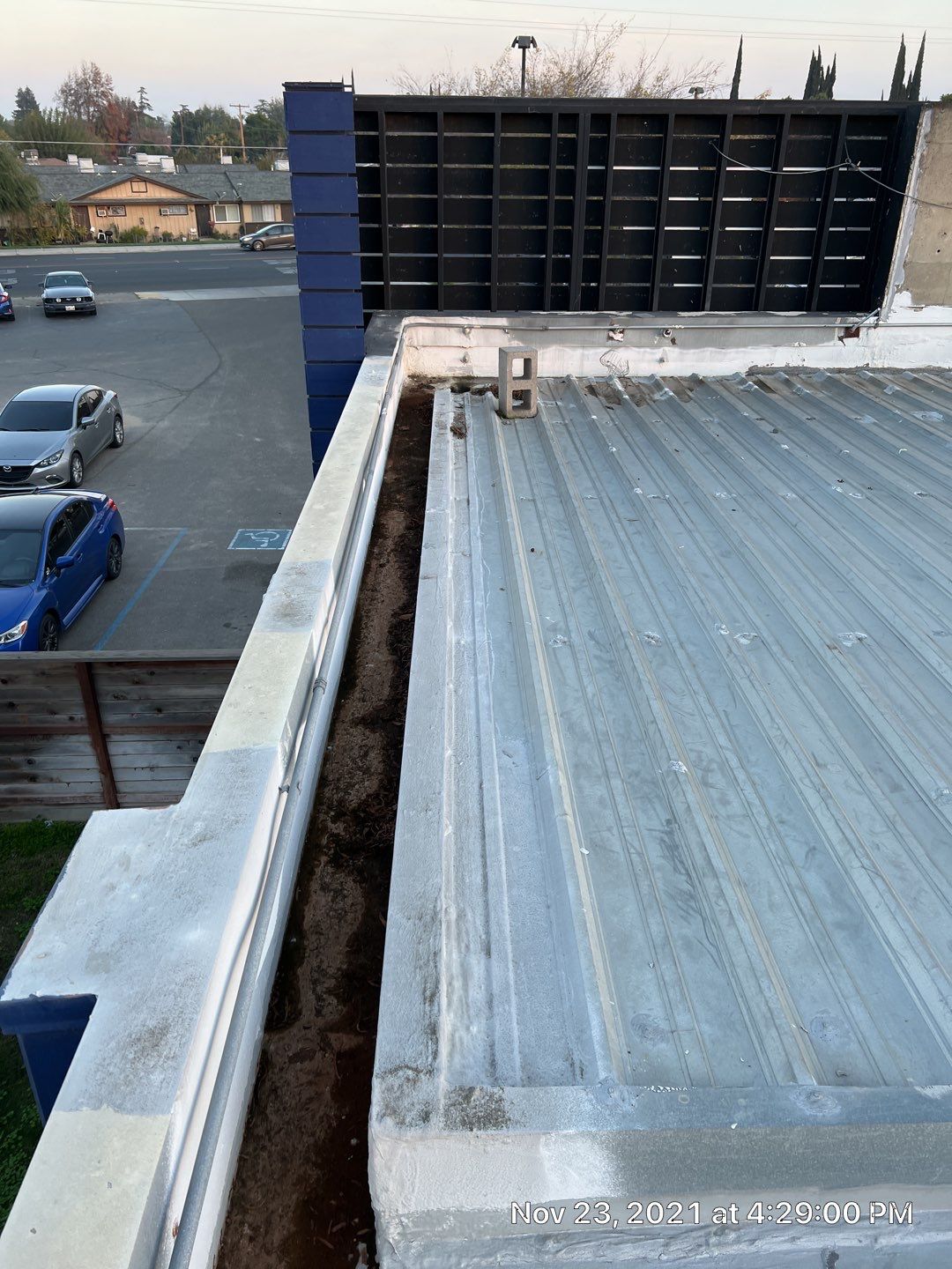 Metal roof restoration on commercial roof using Conklin Benchmark/ PUMA XL acrylic coatings over metal and foam by Straight Edge Roofing Inc
