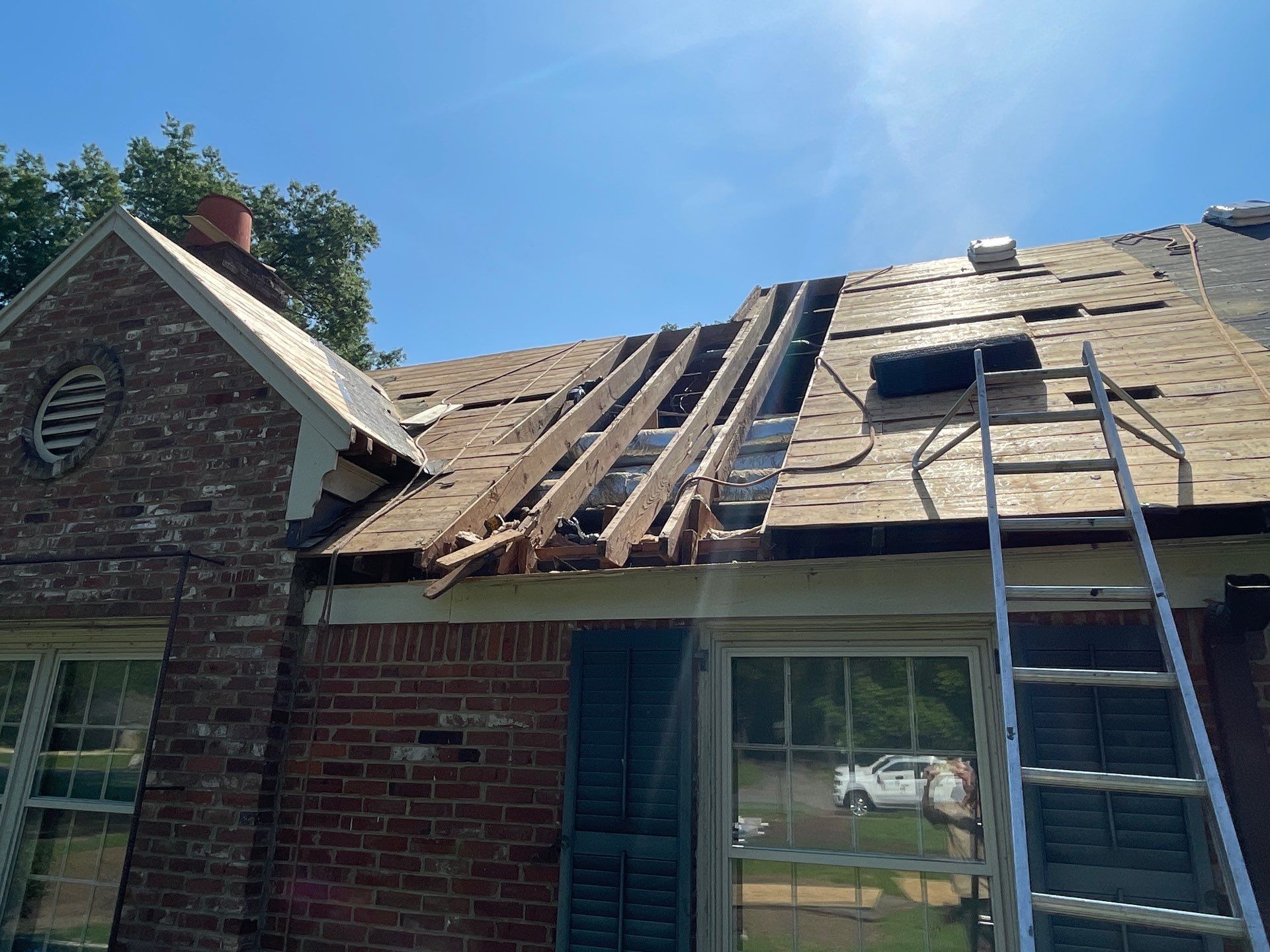 Full Roof Replacement with gutter upgrade after tree impact damage in East Memphis by Revival Roofing Services
