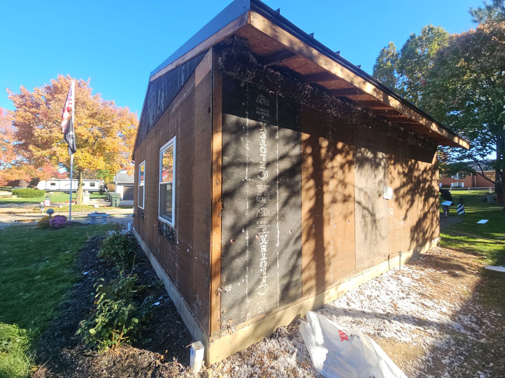 Wadsworth Exterior Transformation Featuring Blue Vertical Siding and Metal Roofing by Cornerstone Roofing And Siding