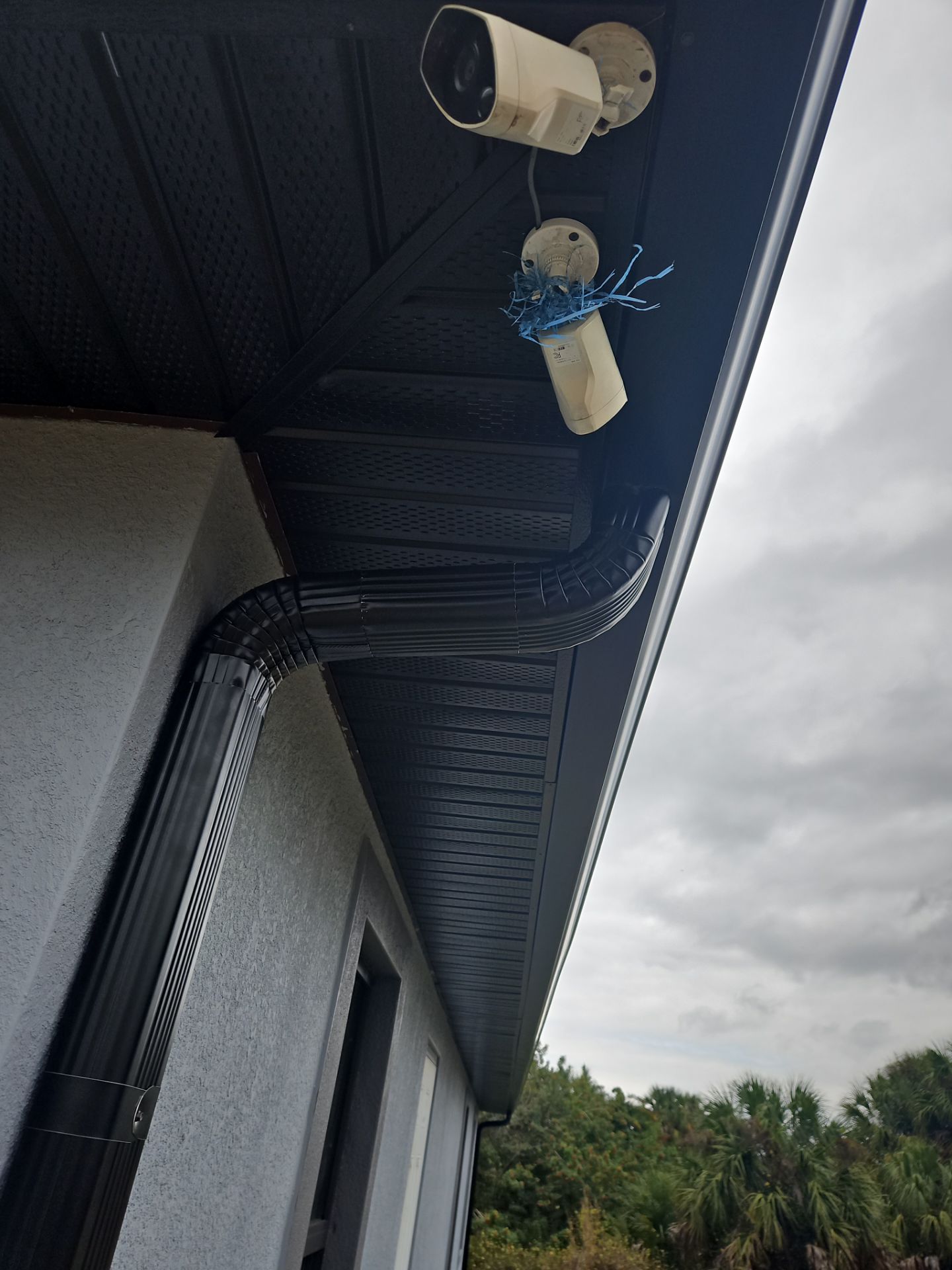 Black Seamless Gutters & Soffit/Fascia in Lehigh Acres FL by Gutter Professors