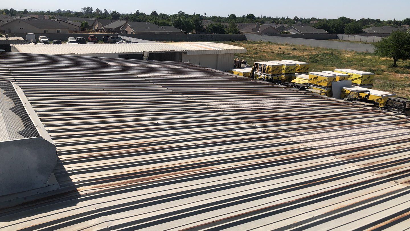 Metal Restoration Roofing system with Benchmark/PUMA XL 20 yr warranty by Straight Edge Roofing Inc