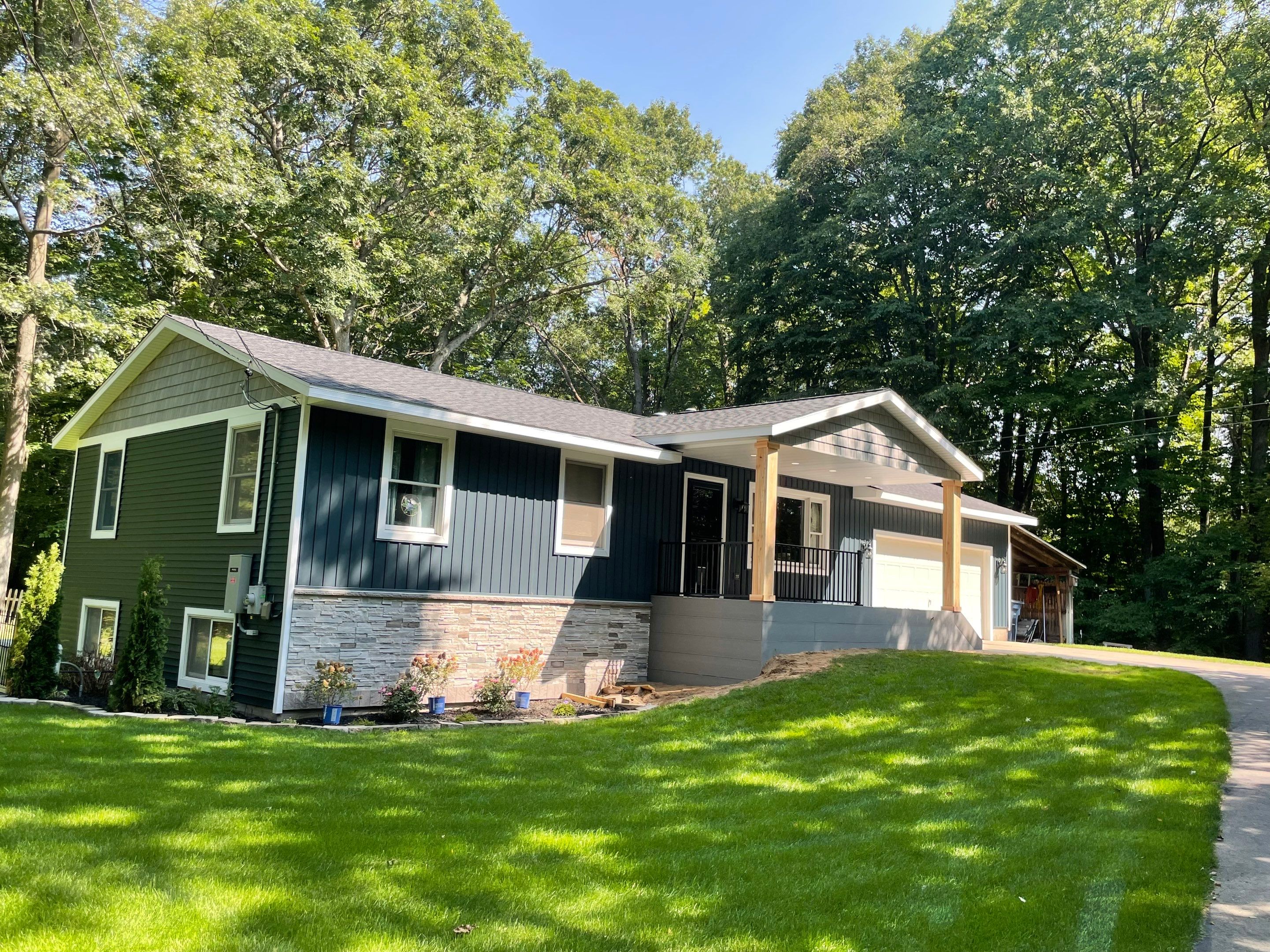 Siding, Deck and Versetta Stone by Avalon Roofing and Exteriors
