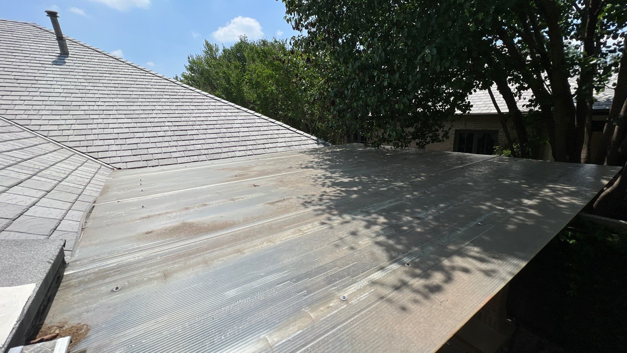 Residential Roofing Installation using Polycarbonate Pergola Roof Panels by Harvey Roofing & Construction