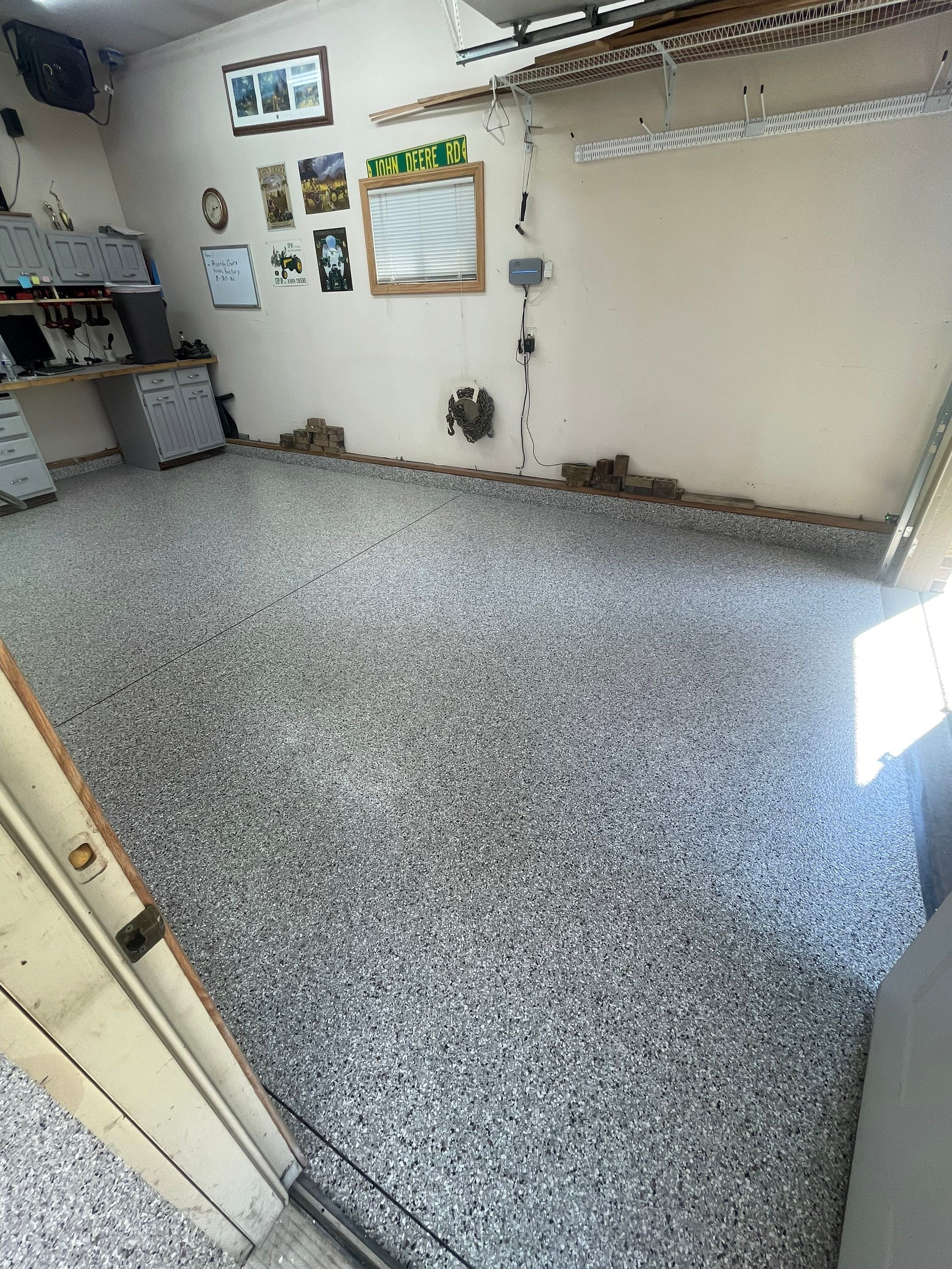 Multi-Stall Garage Floor Coating Installation in Sioux Falls by Select Painting, Coatings & Garage Cabinets