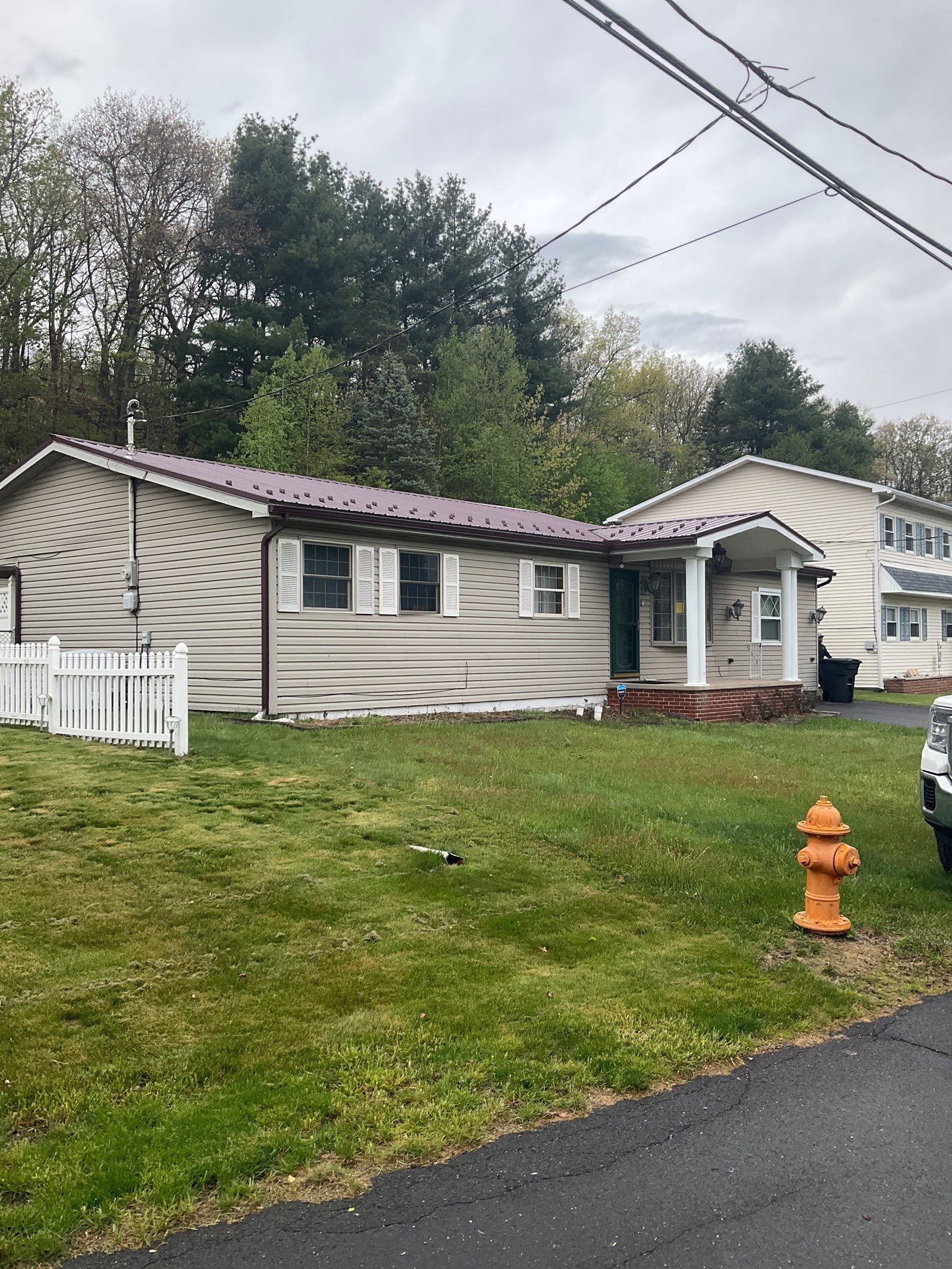 Maroon ABM Metal Roof Replacement and Gutter Installation in Shenandoah by Esh Builders