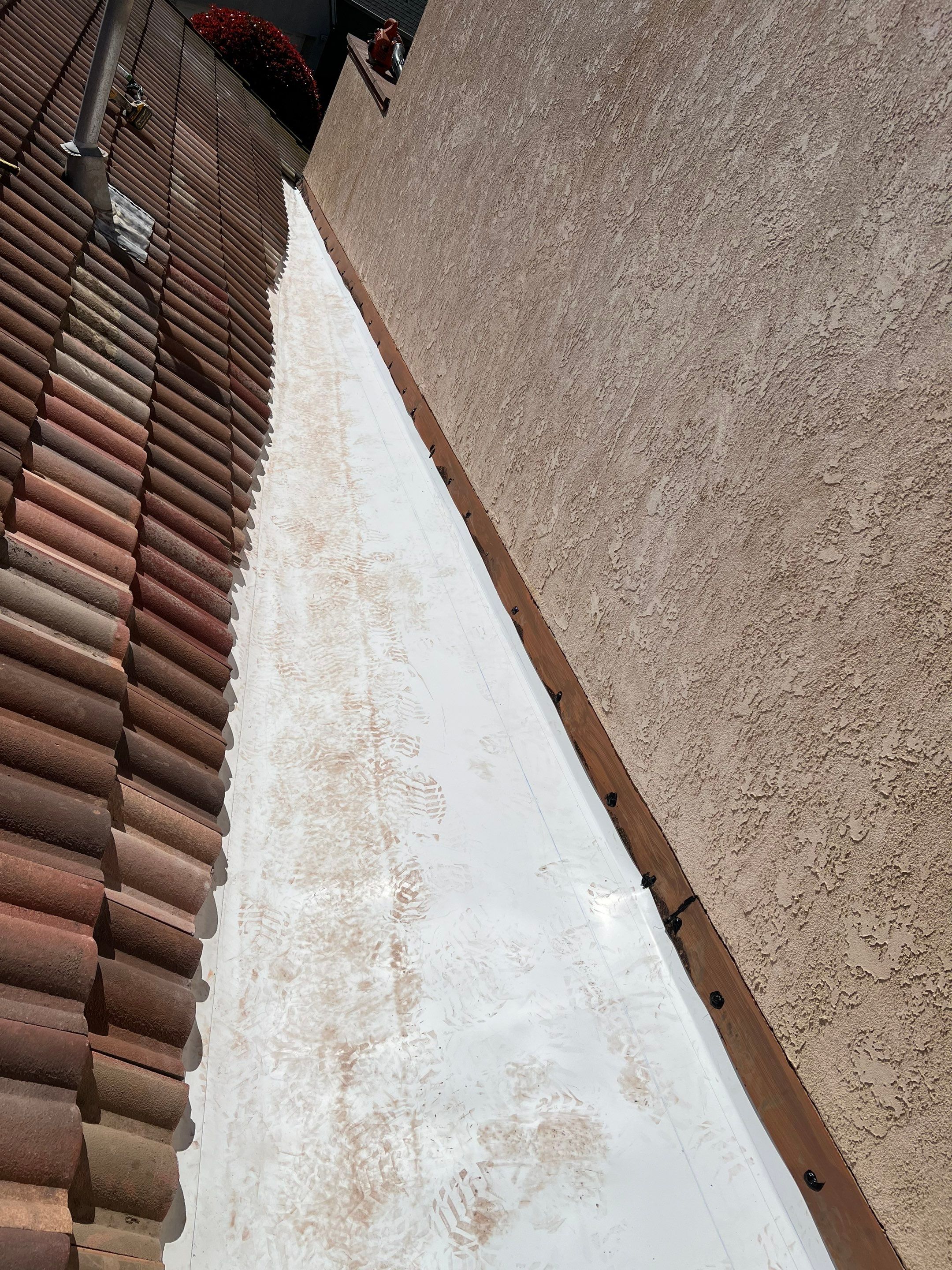 Tile Roof repair by Grandmark Service Company