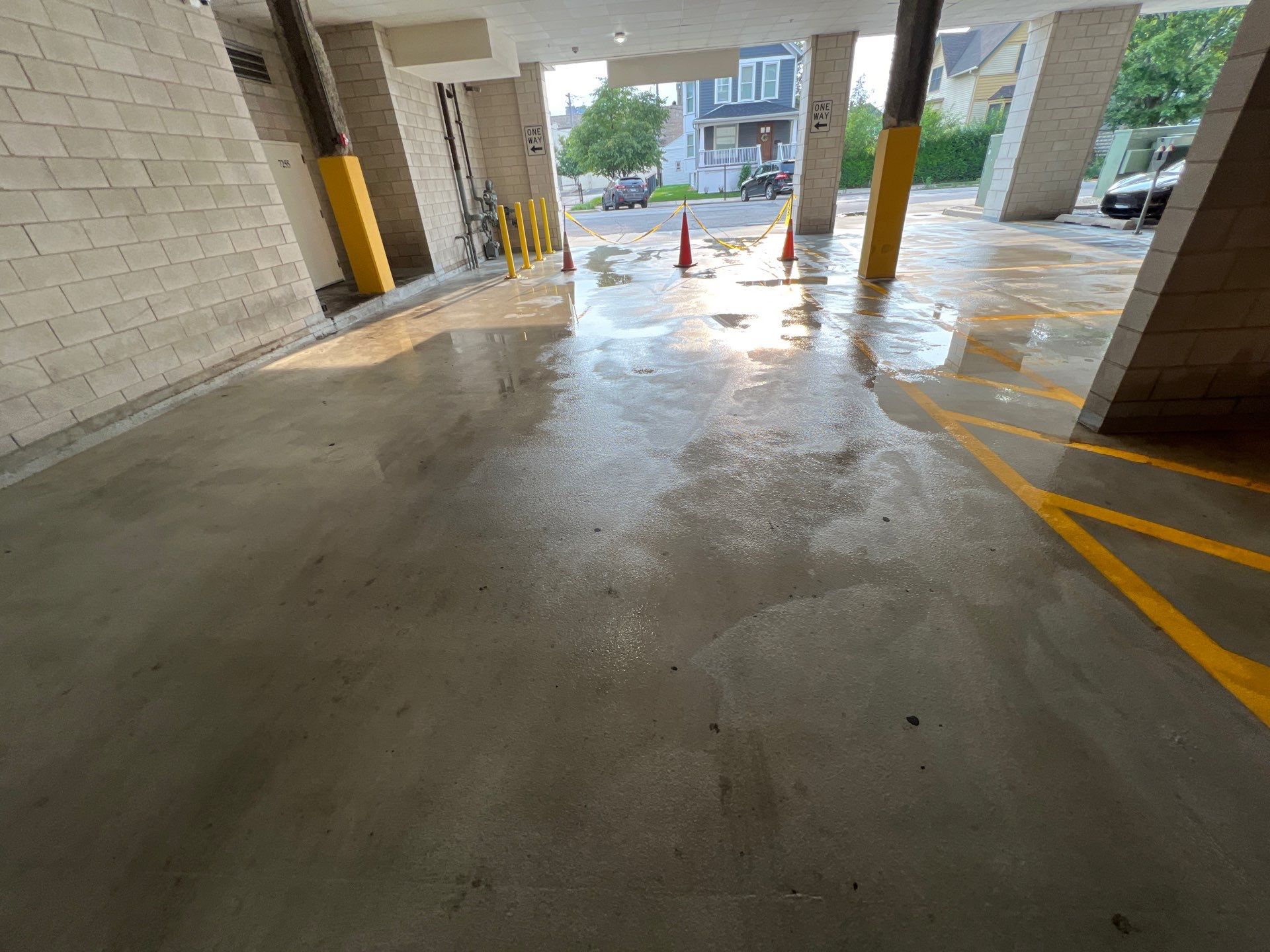 Parking garage using Hot water by Northern Power Washing LLC.