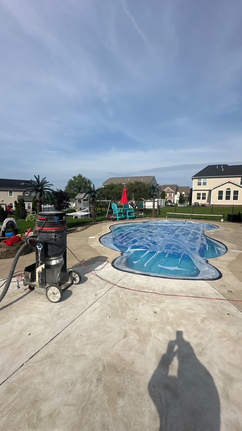 Twilight Pool Deck / Patio Project in Beaver falls by Floors in a Day, Inc