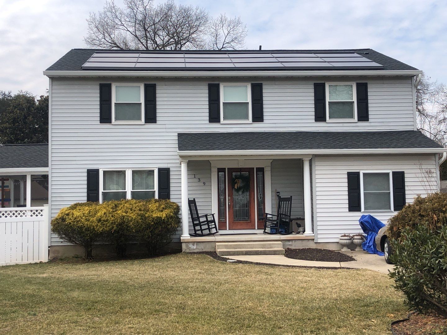 Roof Replacement with GAF Decotech integrated solar panels by American Home Contractors