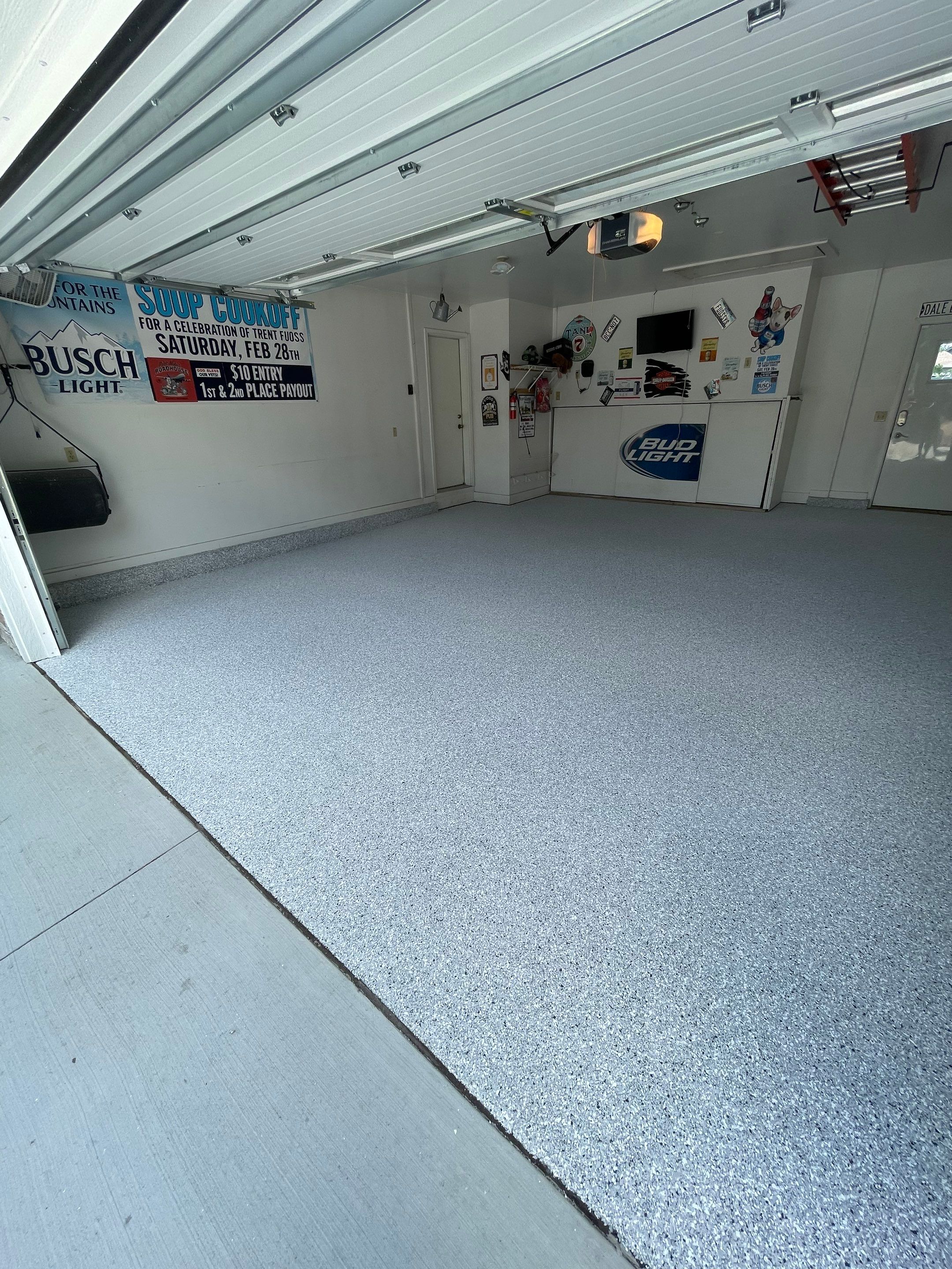 Residential Garage Floor Coating with Feather Grey Finish in Sioux Falls by Select Painting, Coatings & Garage Cabinets
