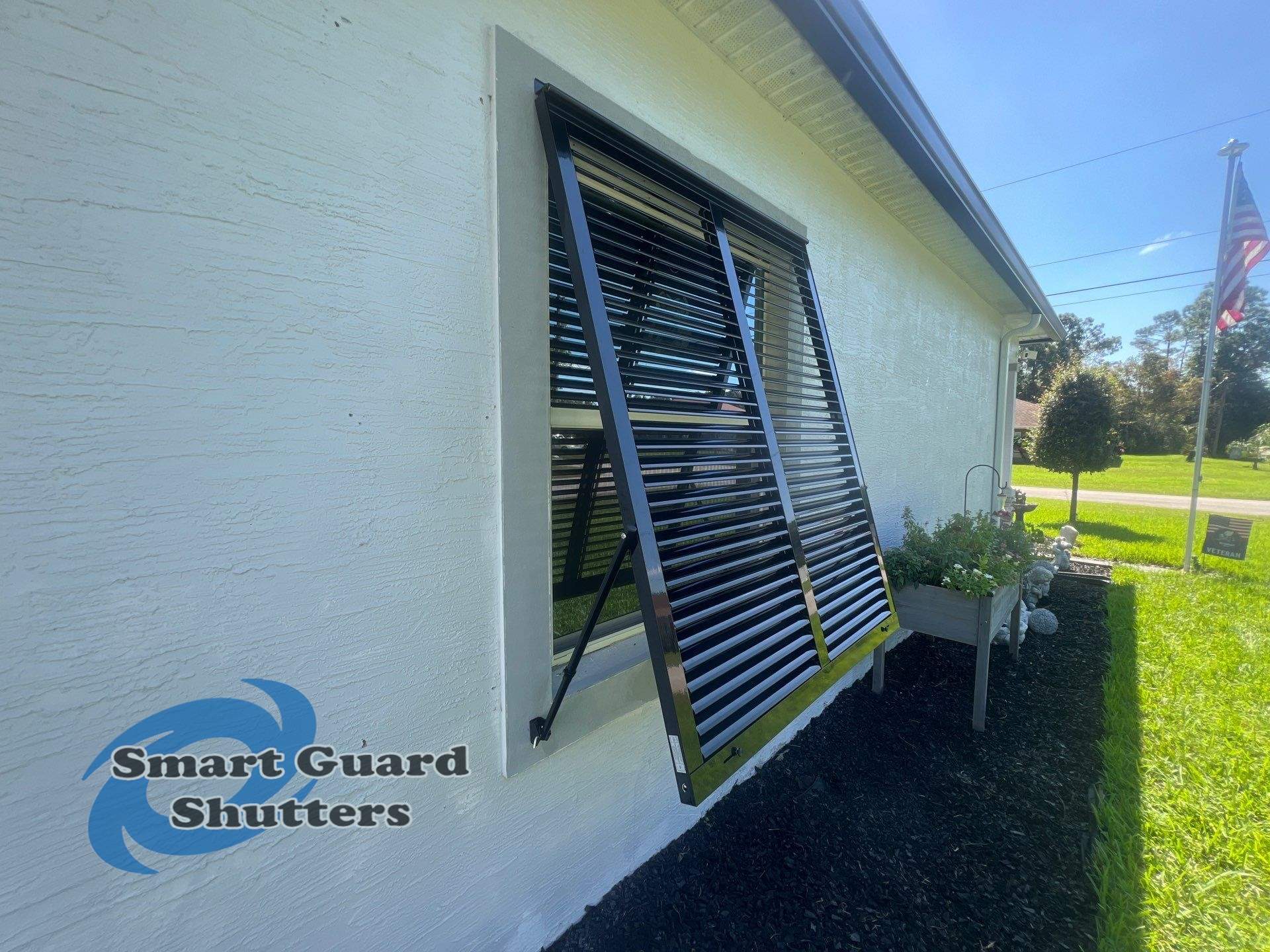 Impact Bahama Shutters in Jet Black by Smart Guard Shutters