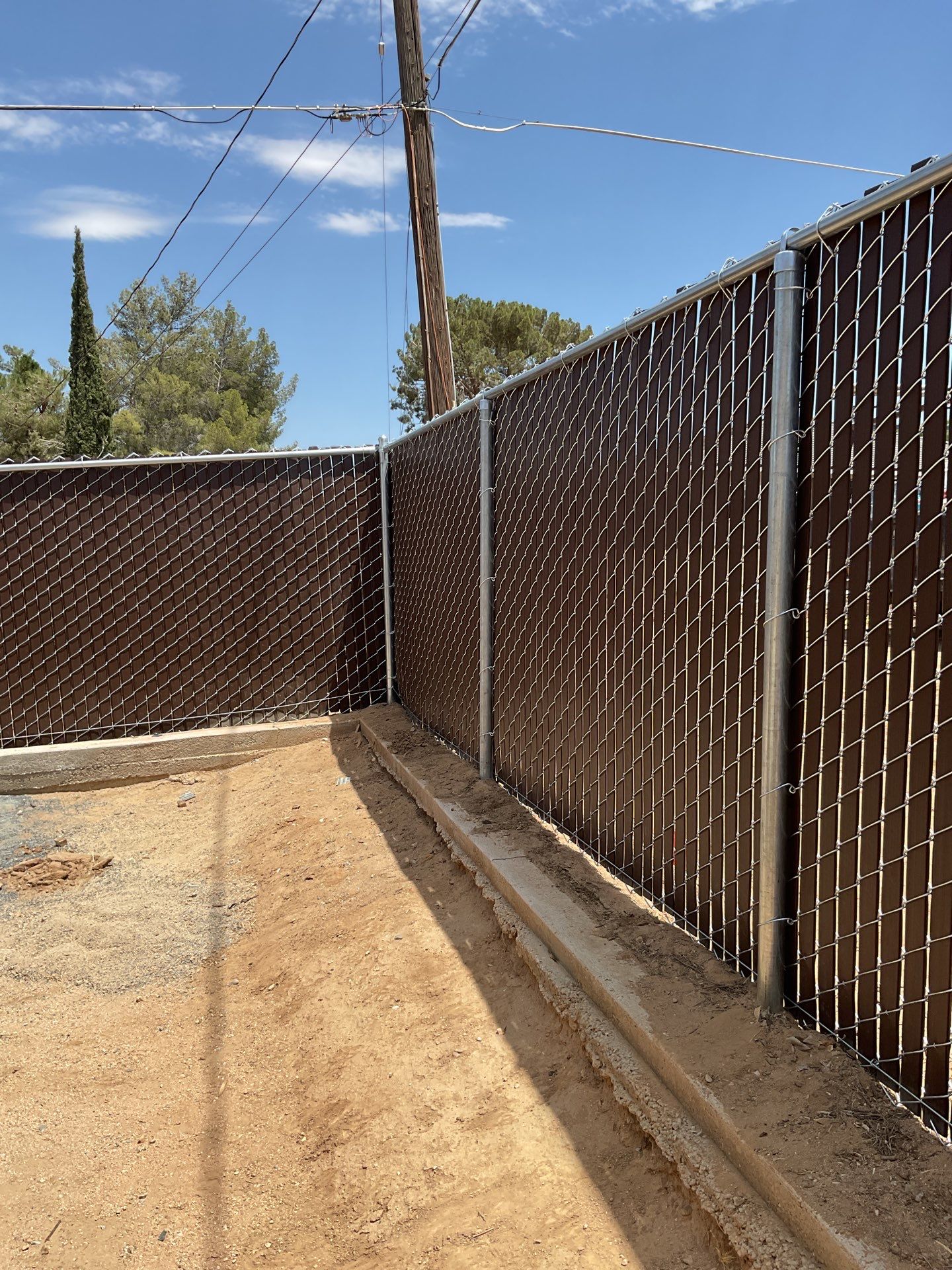 Dark Brown Privacy Chain Link Fence by Fence Guys Inc.