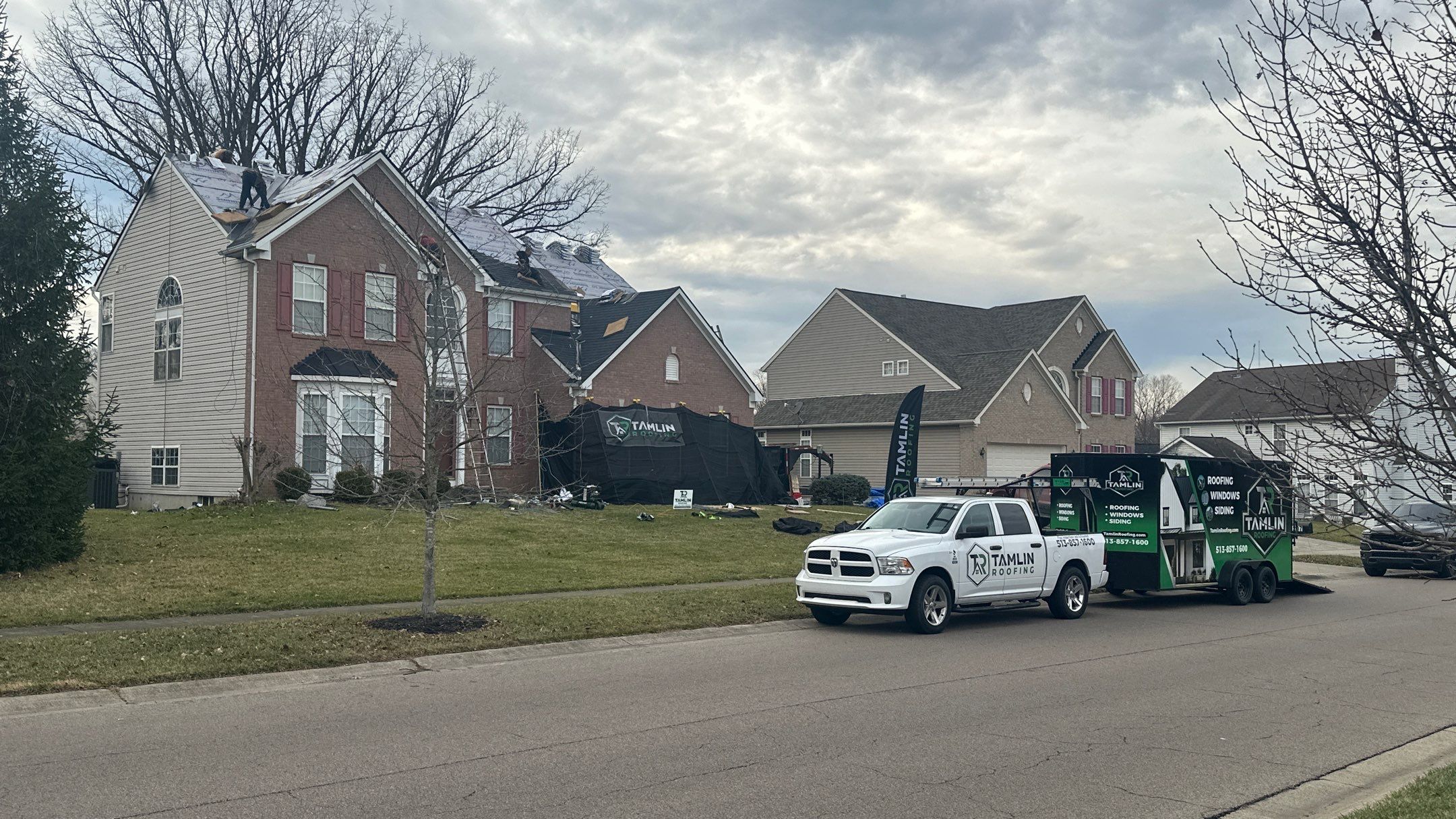 Walden Ponds - Pristine Black and Hydro Flo Gutter Guards by Tamlin Roofing