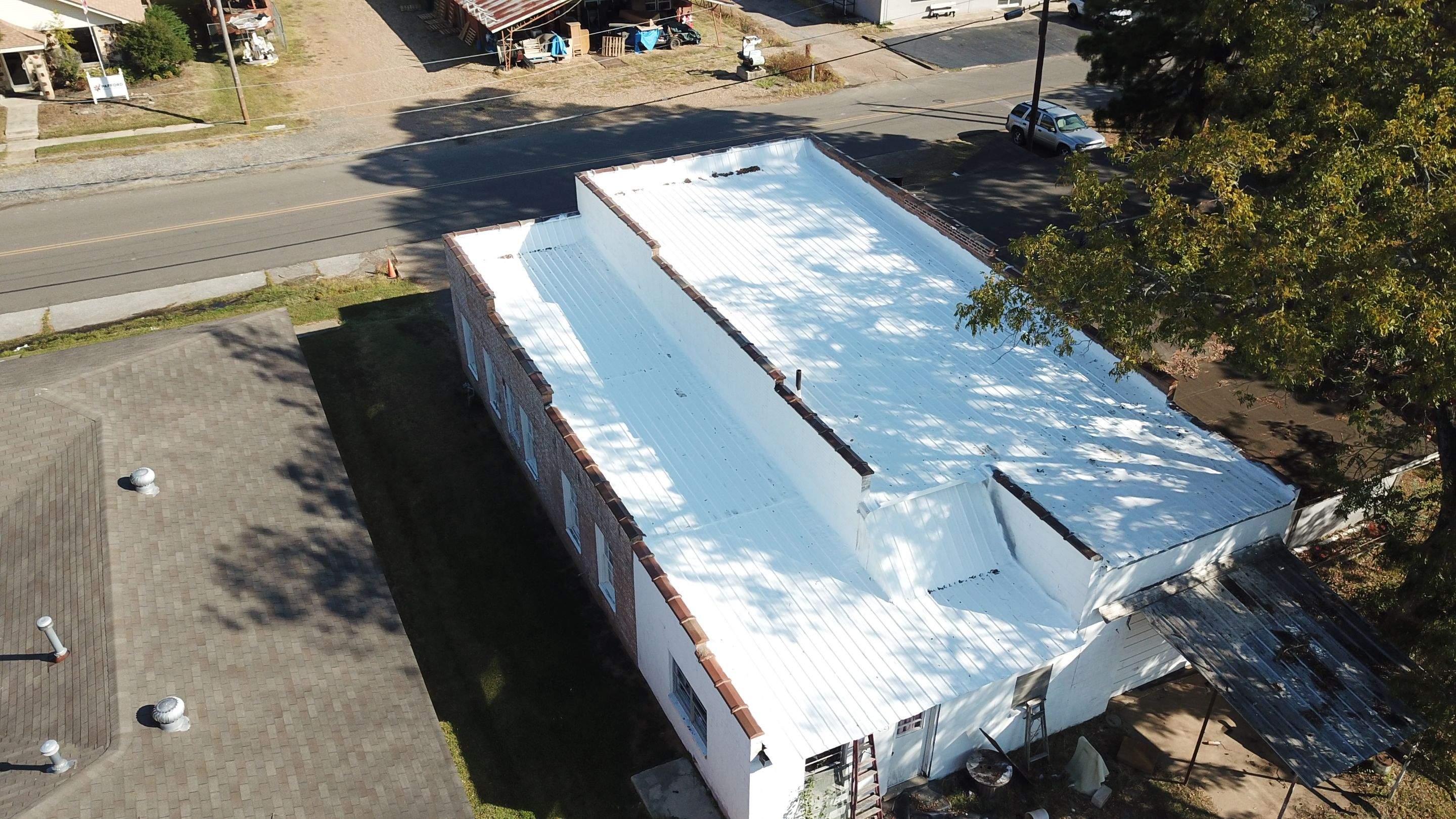 Commercial Roofing Installation using Aldocoat Coatings by Hostetler Roofing