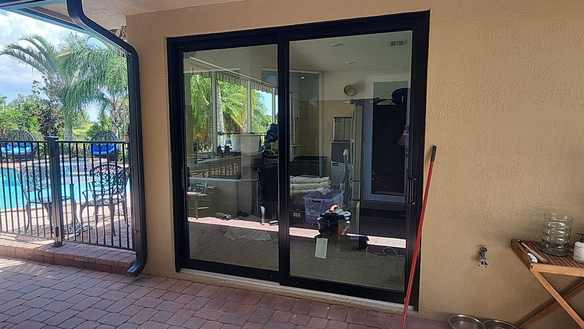PGT Black pocket doors and Euro-Wall storefront & SGD by Windows For Life 