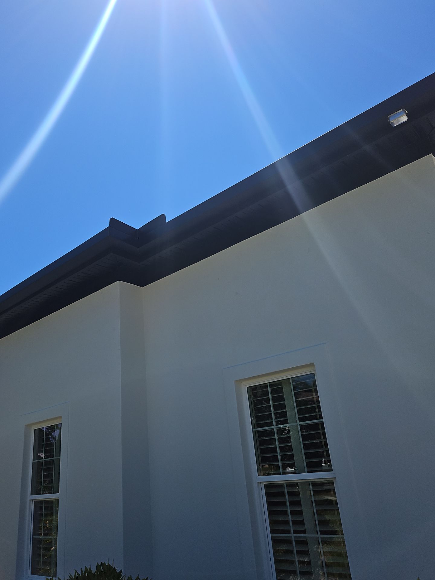 Soffit and Fascia Installation and black seamless gutters in Sarasota FL by Gutter Professors