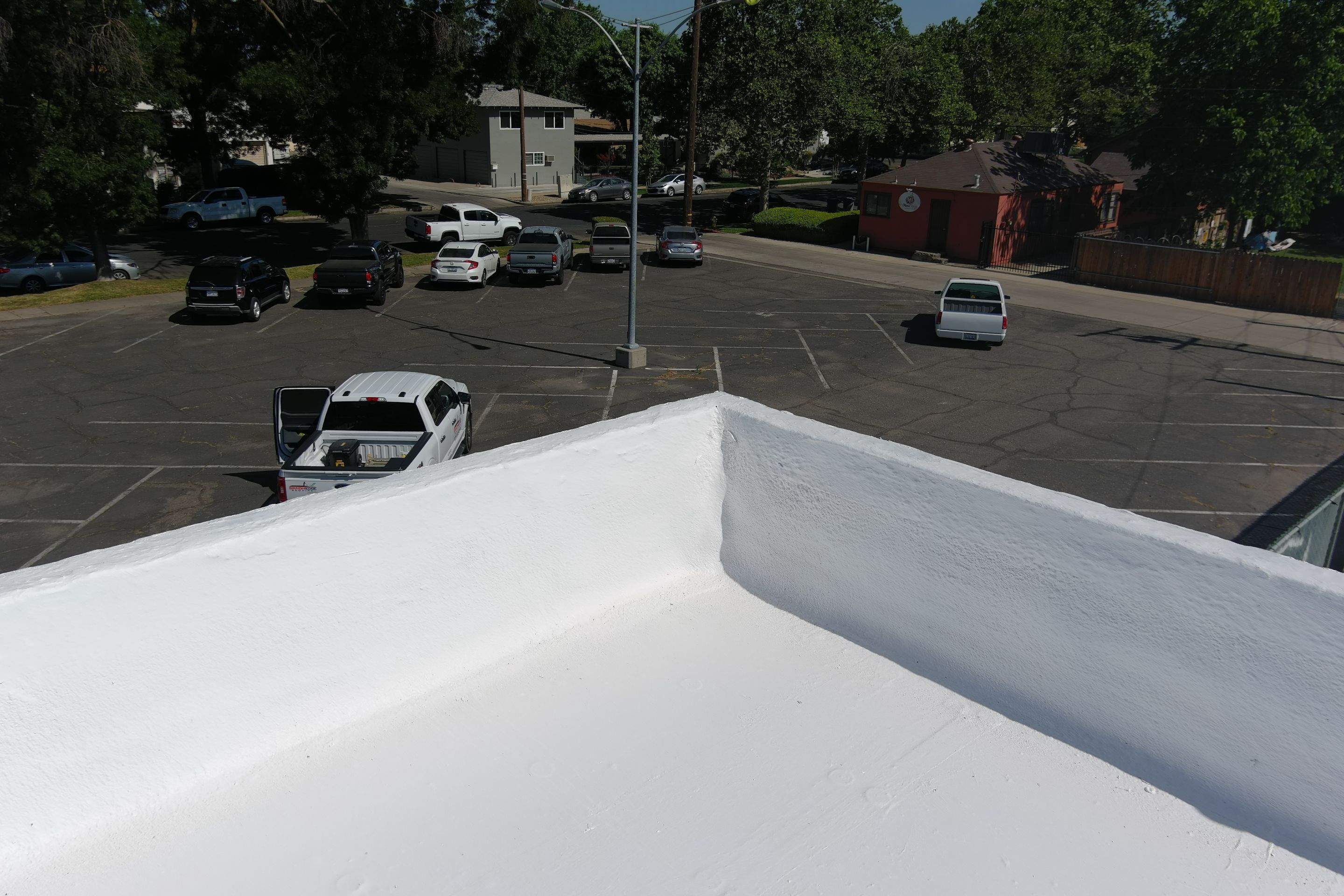 Commercial Roofing Installation using Conklin BenchPly system with PUMA top coat (imbedded fabric system) by Straight Edge Roofing Inc