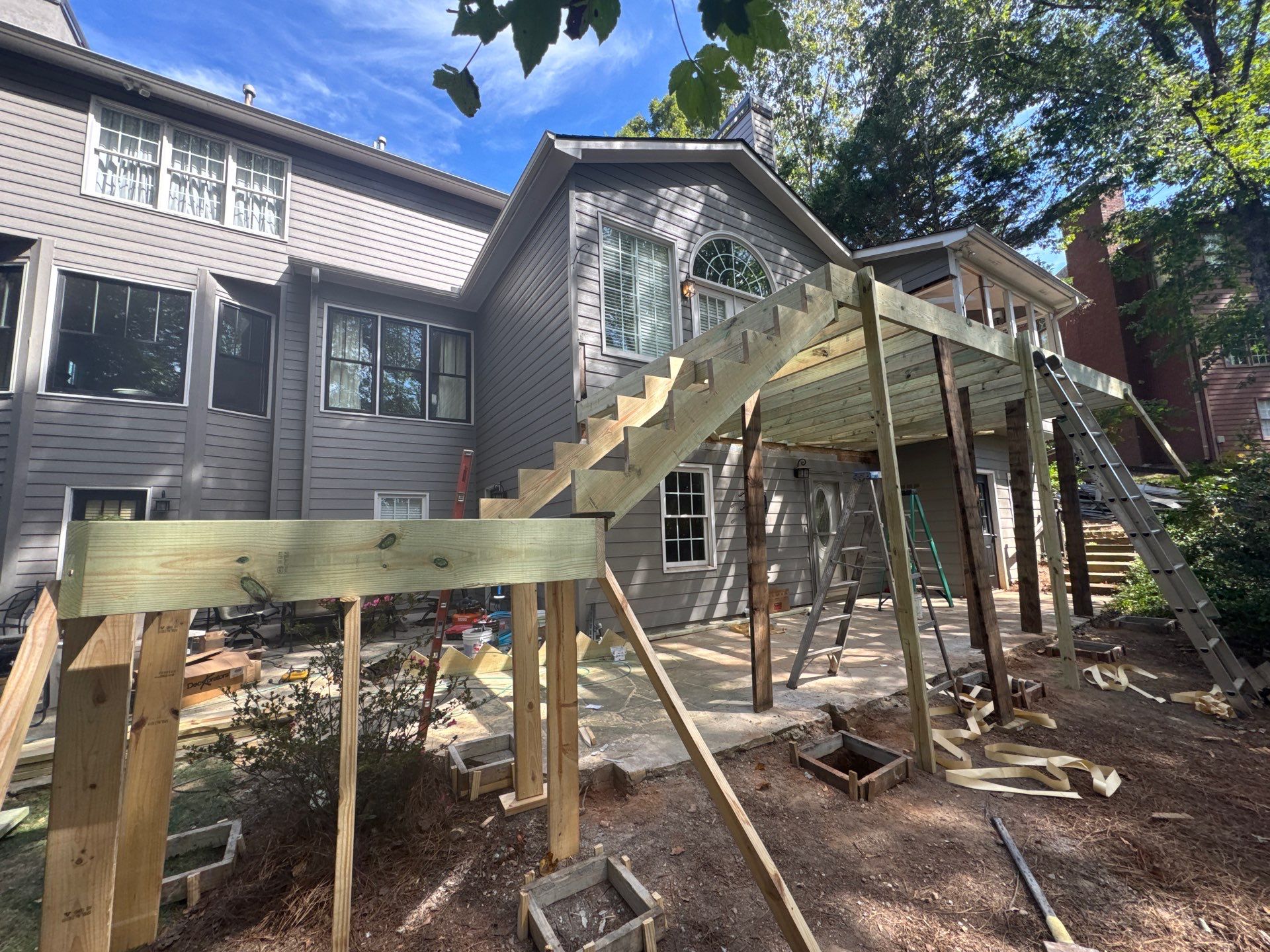 Custom Multi-Level Composite Deck and Sunroom Addition in Suwanee by Swift Home Renovations 