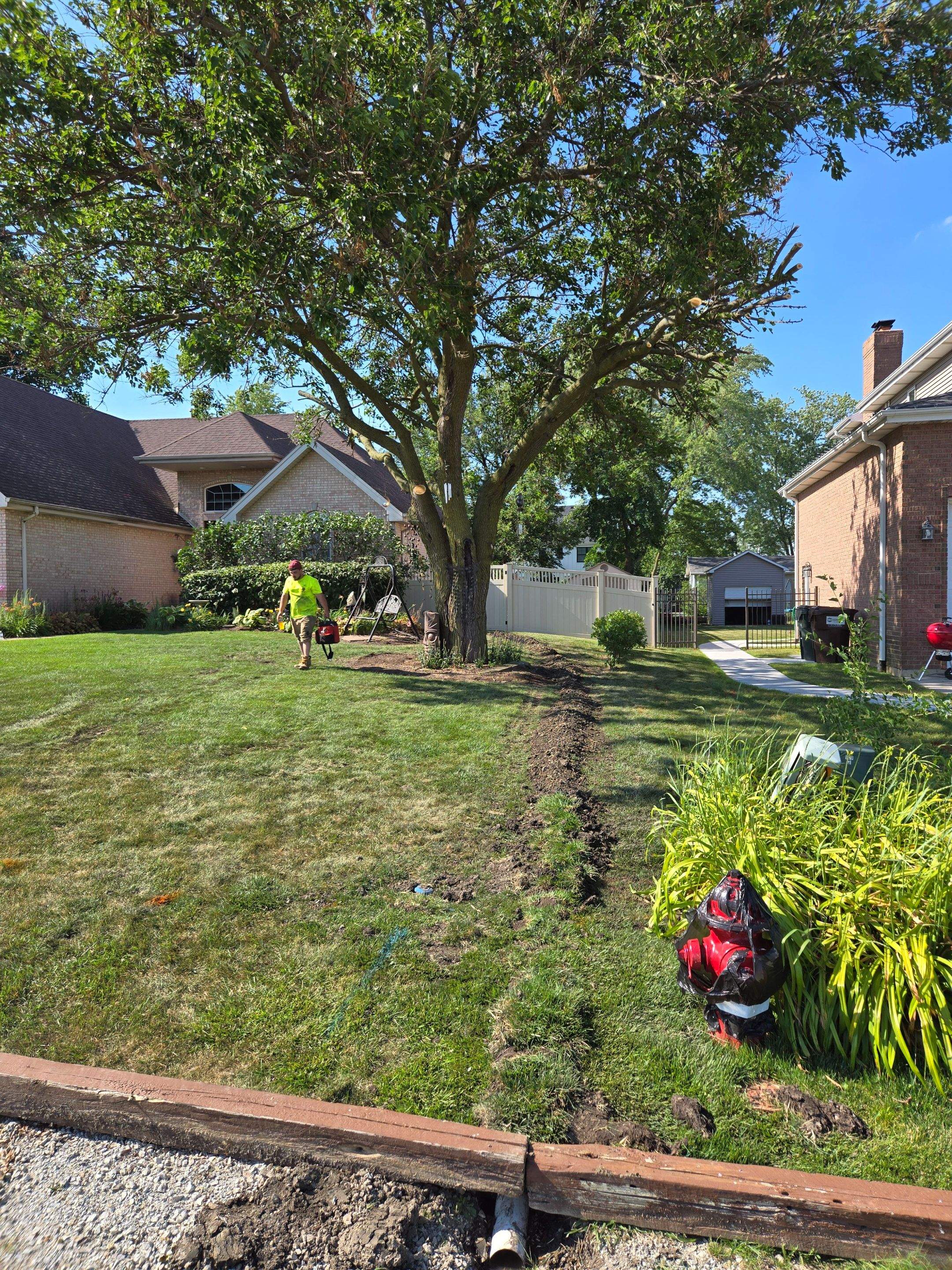 Burial of Sump Pump and Down Spout Discharges and Partial Waterproofing of Wall by Allied Water Services