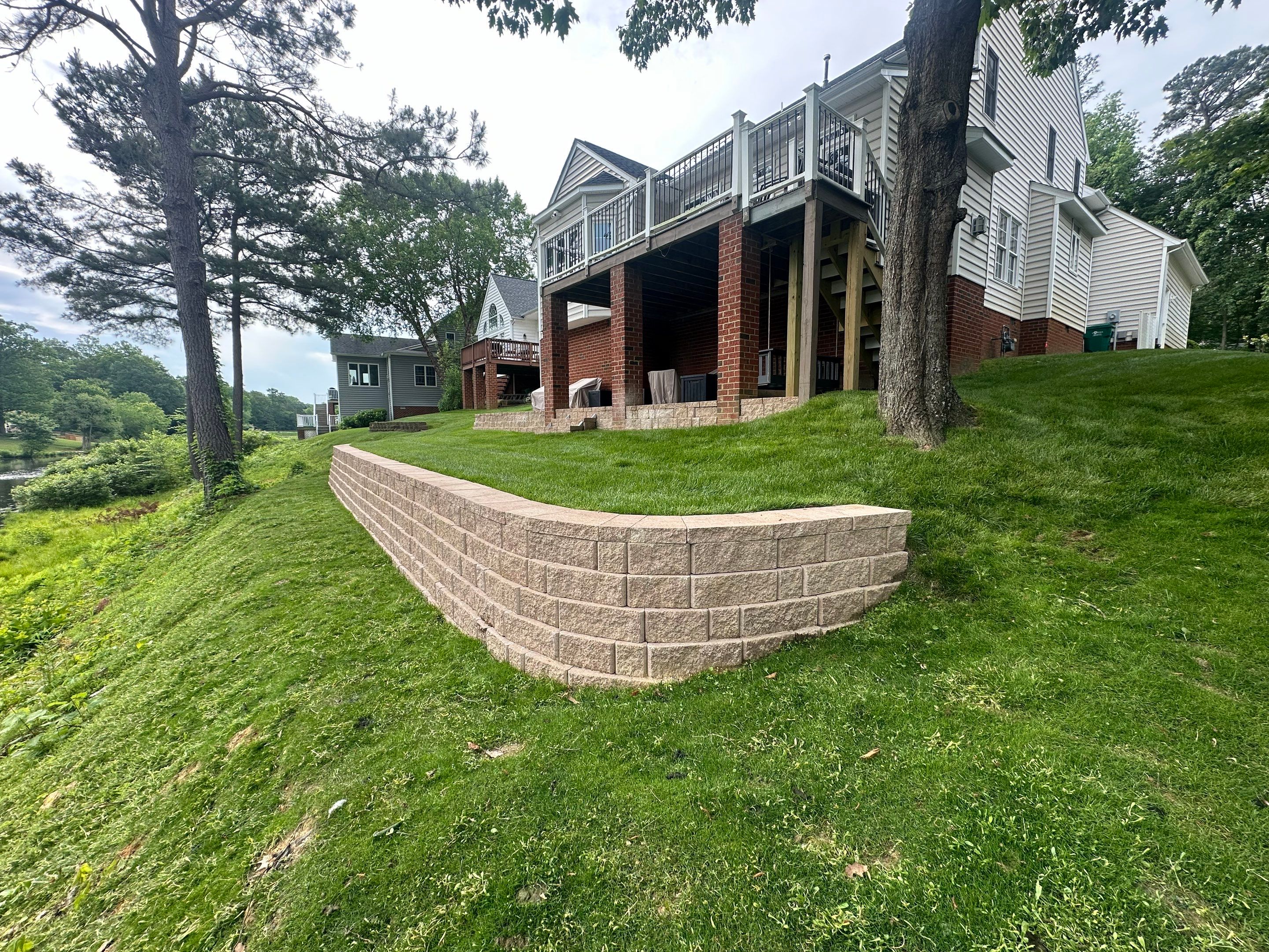 Hillside Retaining Wall & Outdoor Area by Executive Lawn and Landscape 
