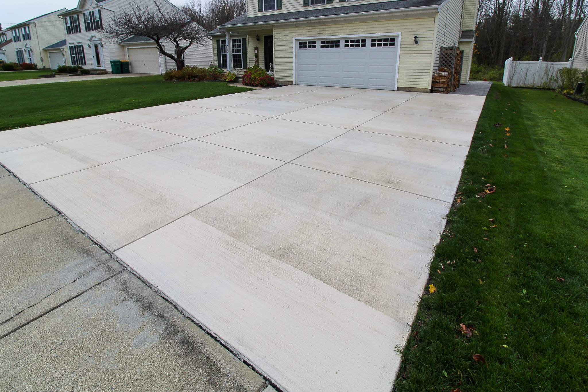 Stamped Concrete, Entry Door, and Concrete  by Ivy Lea Construction