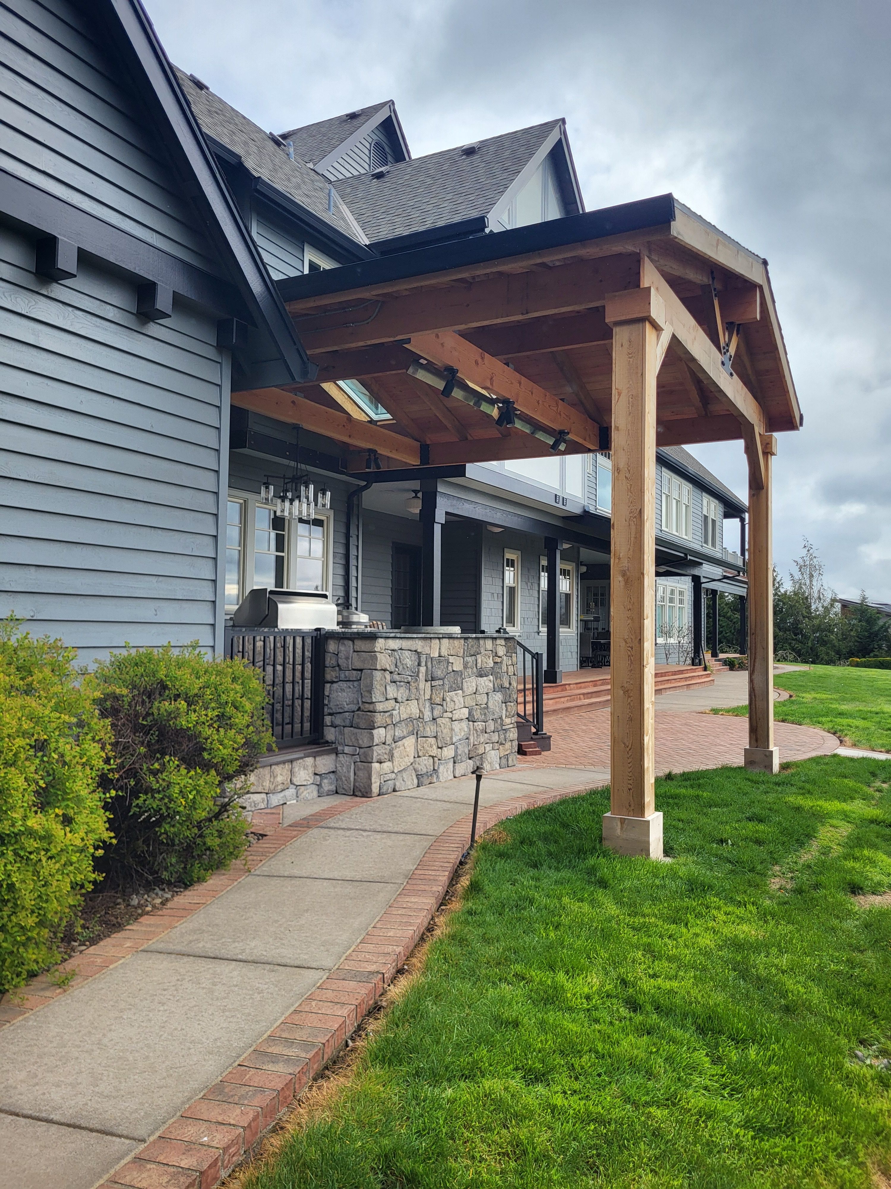 Custom Outdoor Kitchen and Timber-Framed Pavilion in Sherwood by American Made Construction 