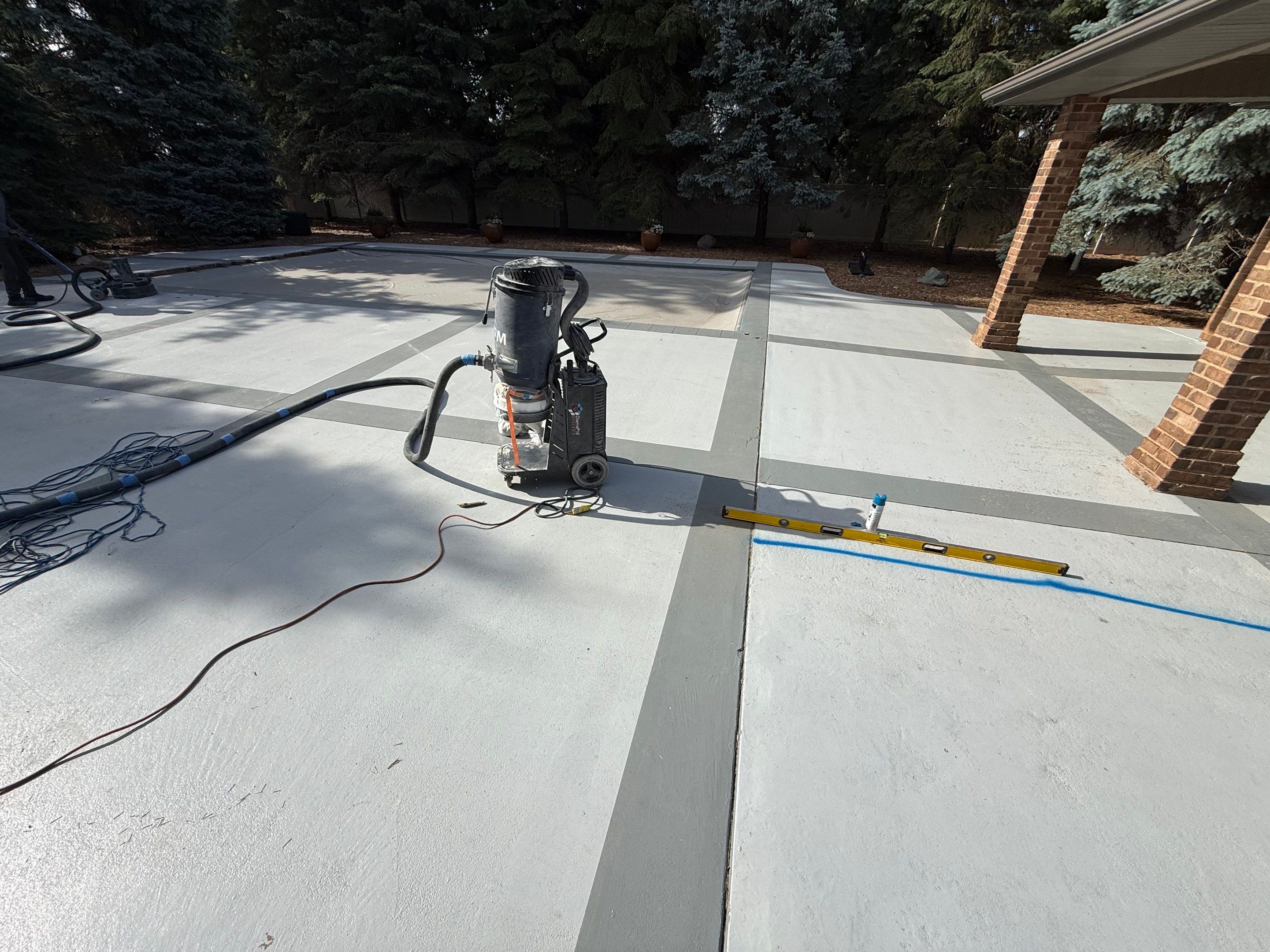 Decorative Concrete Pool Deck and Patio Resurfacing in Sioux Falls by Select Painting, Coatings & Garage Cabinets