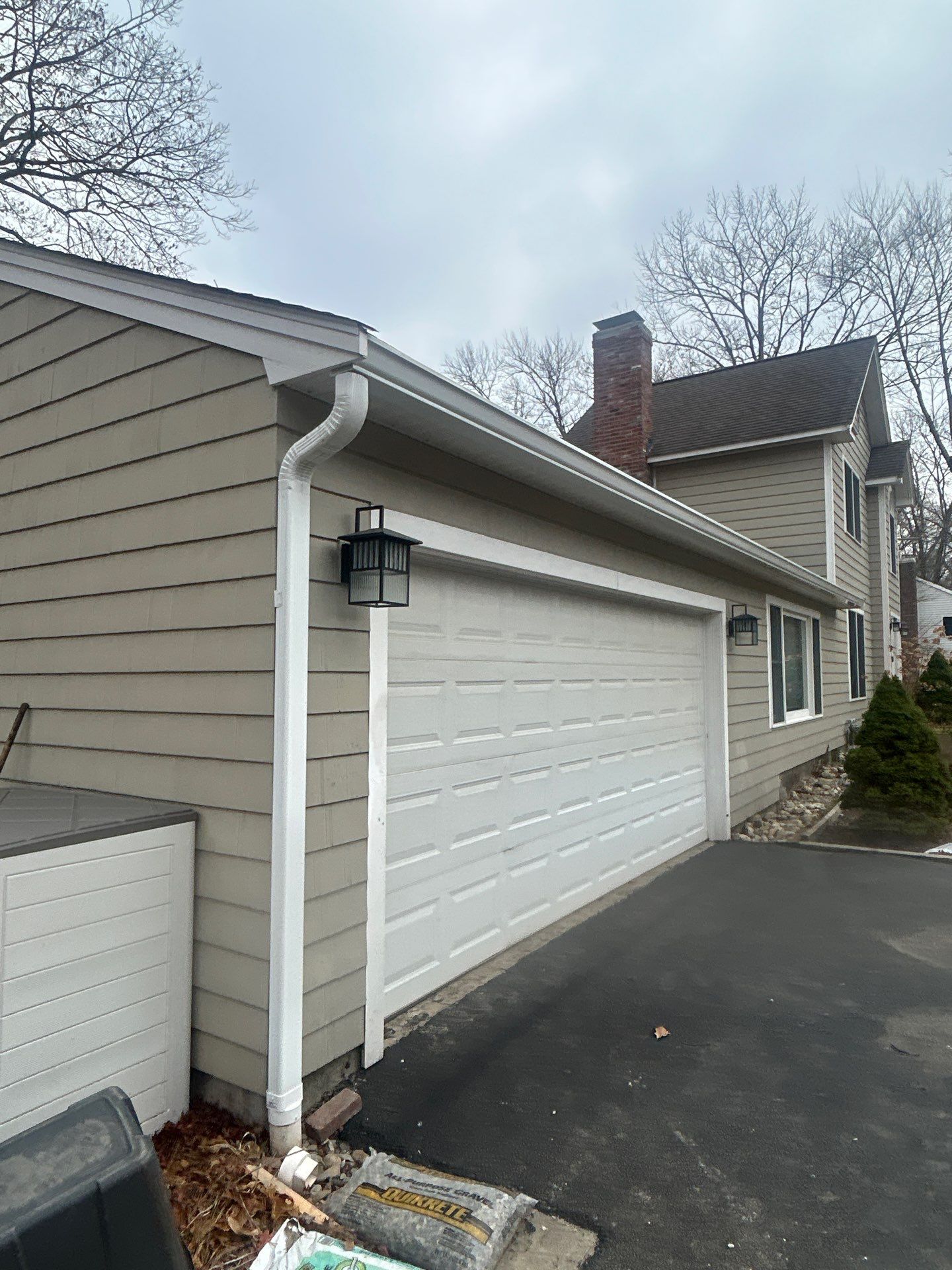 Chelmsford Garage Gutter System with French Drain Integration by Mighty Dog Roofing of Greater Middlesex County