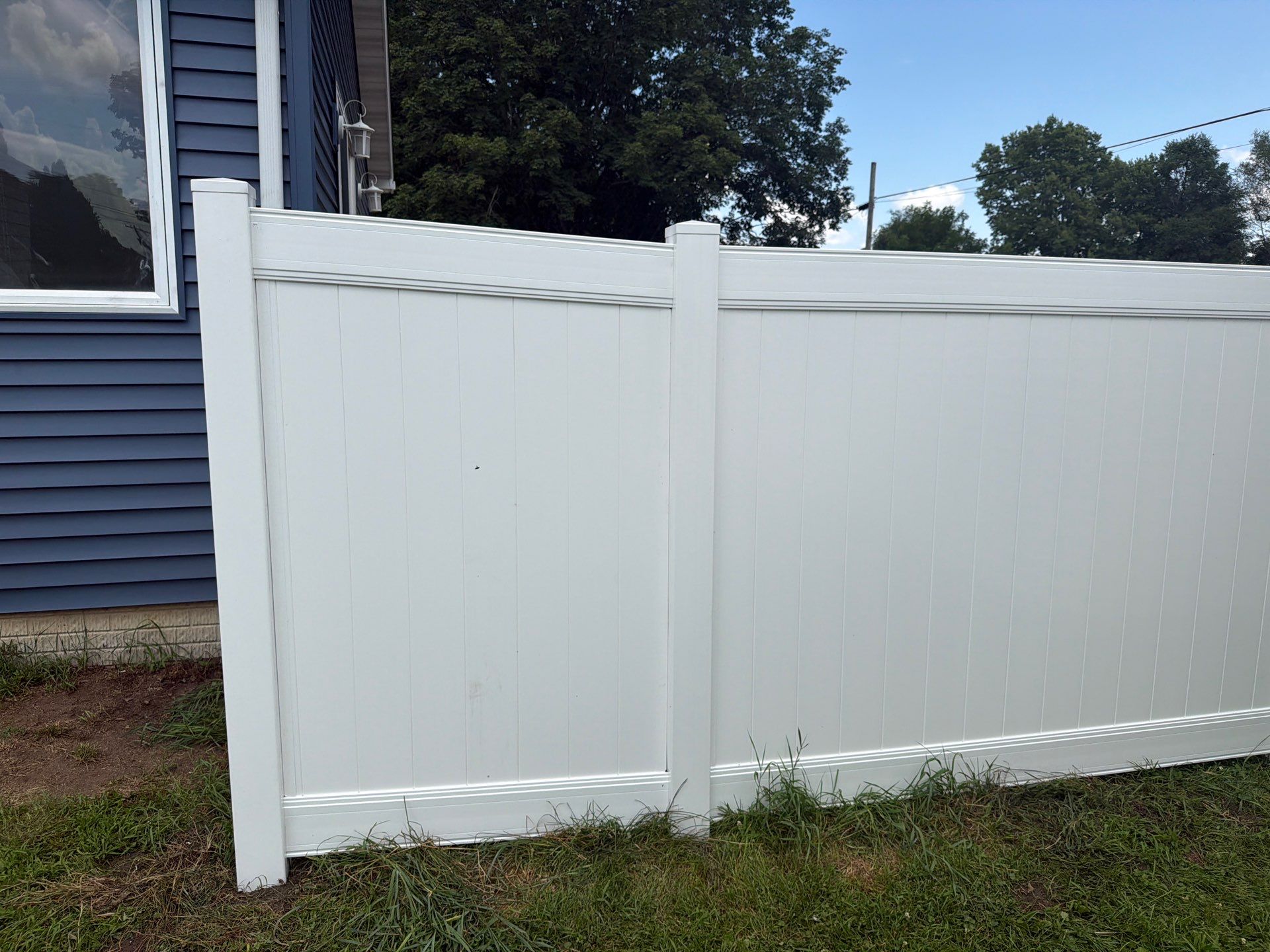 White Vinyl Privacy Fence Installation in Waterloo, Iowa by Perfect Picket Fence and Stain