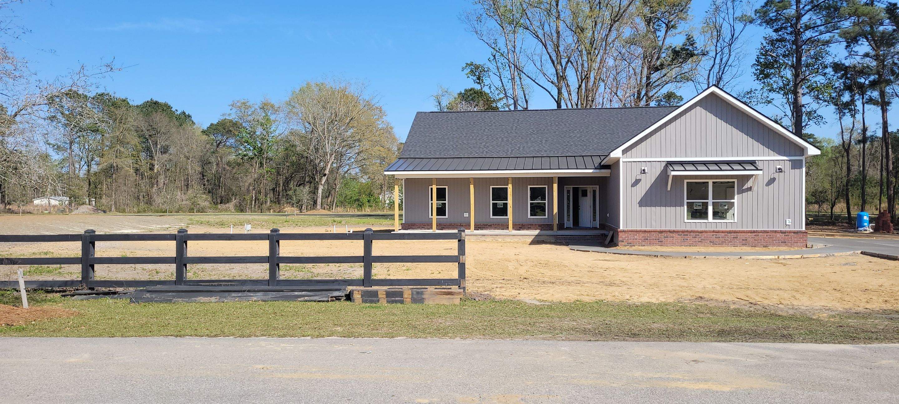 New Home Construction using brick and vertical vinyl by Cornerstone Home Builders, LLC