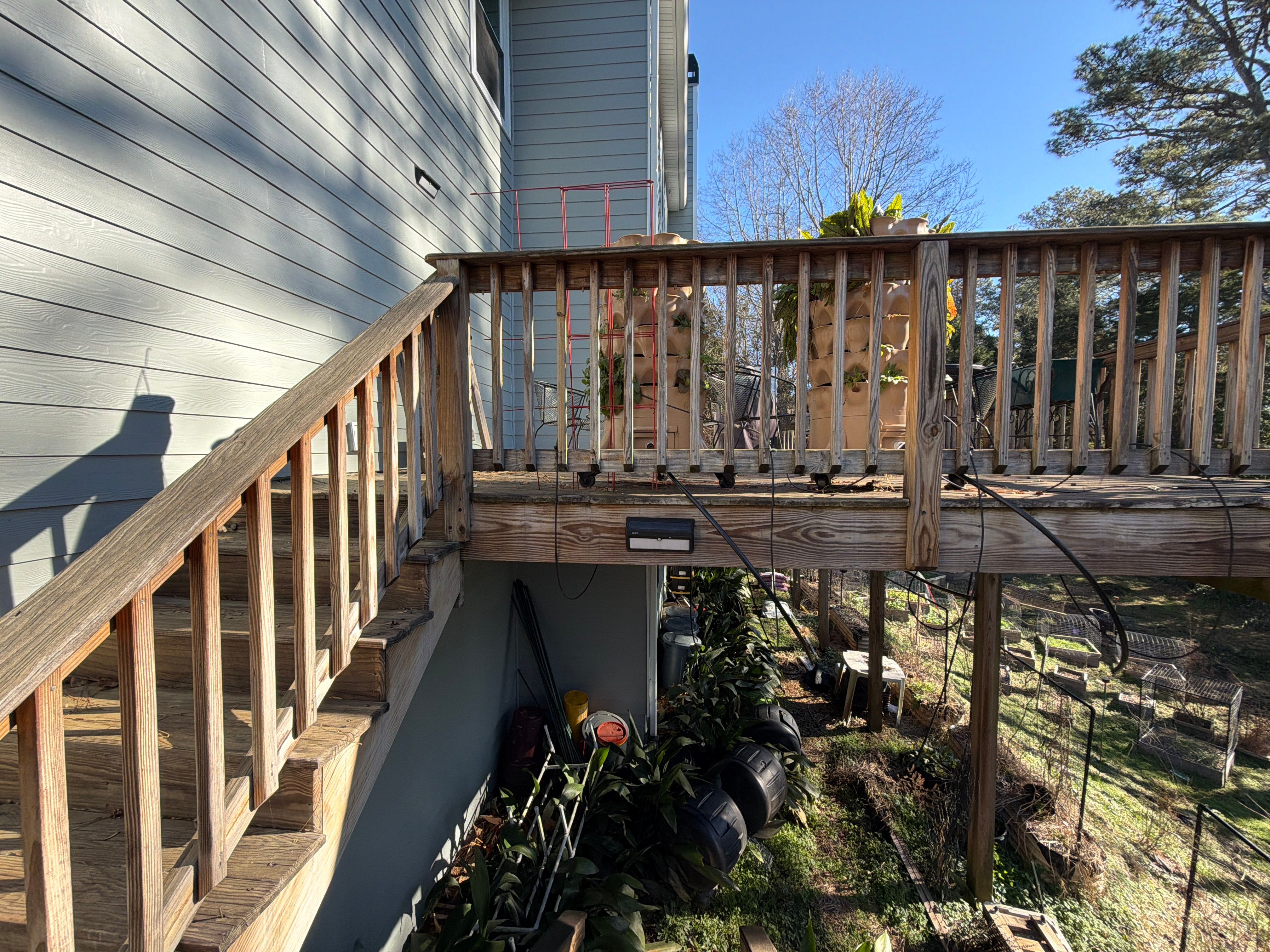 Covered Porch and Deck Build using Deckorators Venture Series Decking and Trex Select Aluminum Railing by Nelson Exteriors