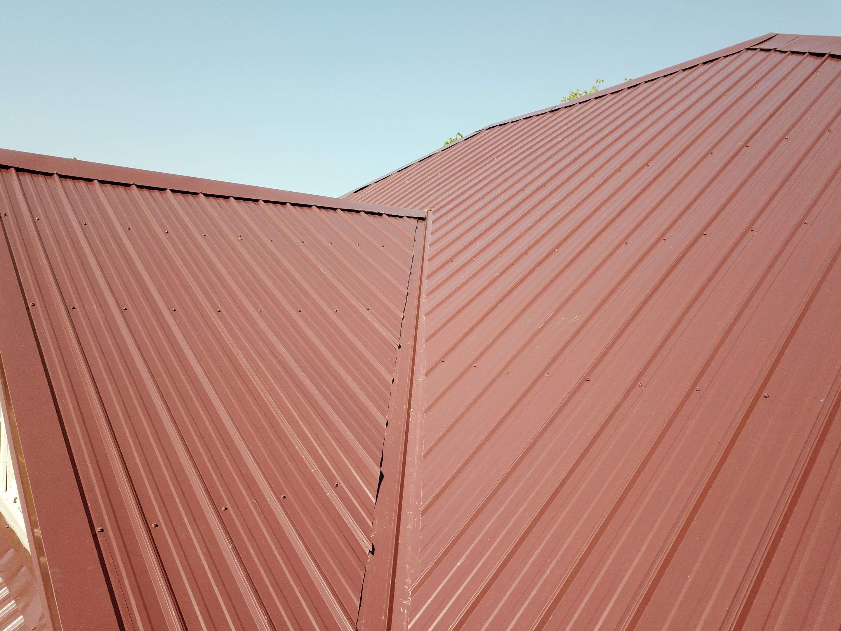 Residential Metal Roof Replacement using Reed's Metals: Colored Residental Panel (Burgundy) by Hostetler Roofing