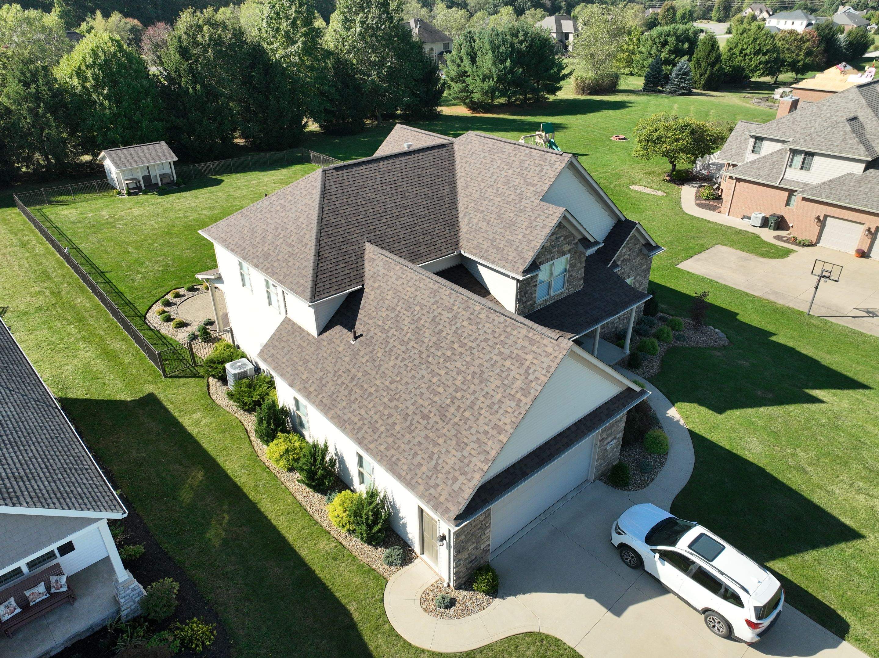 Timeless in Teak: Wooster Roof Revitalization by Cornerstone Roofing And Siding